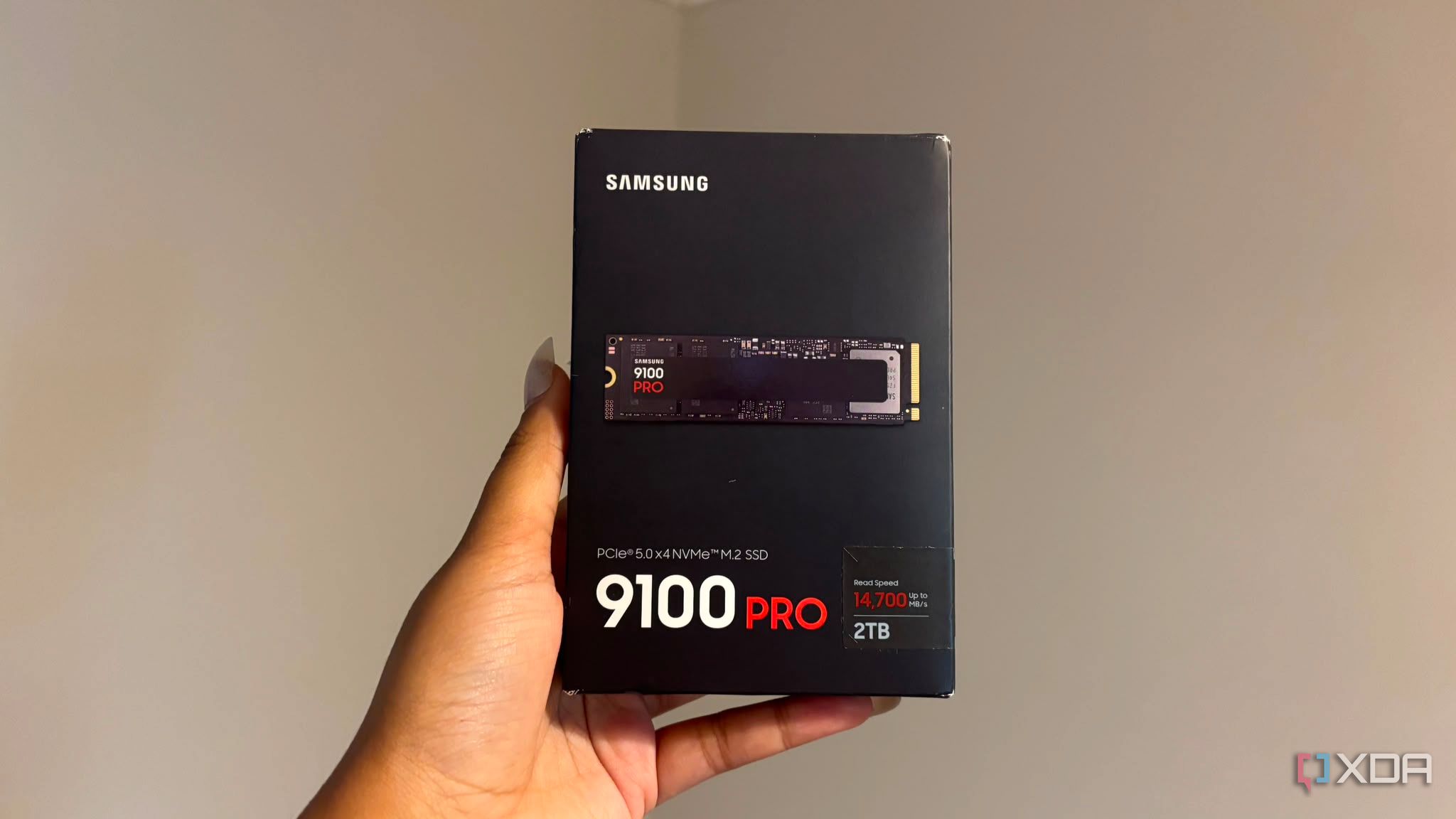 Samsung 9100 pro SSD box being held up
