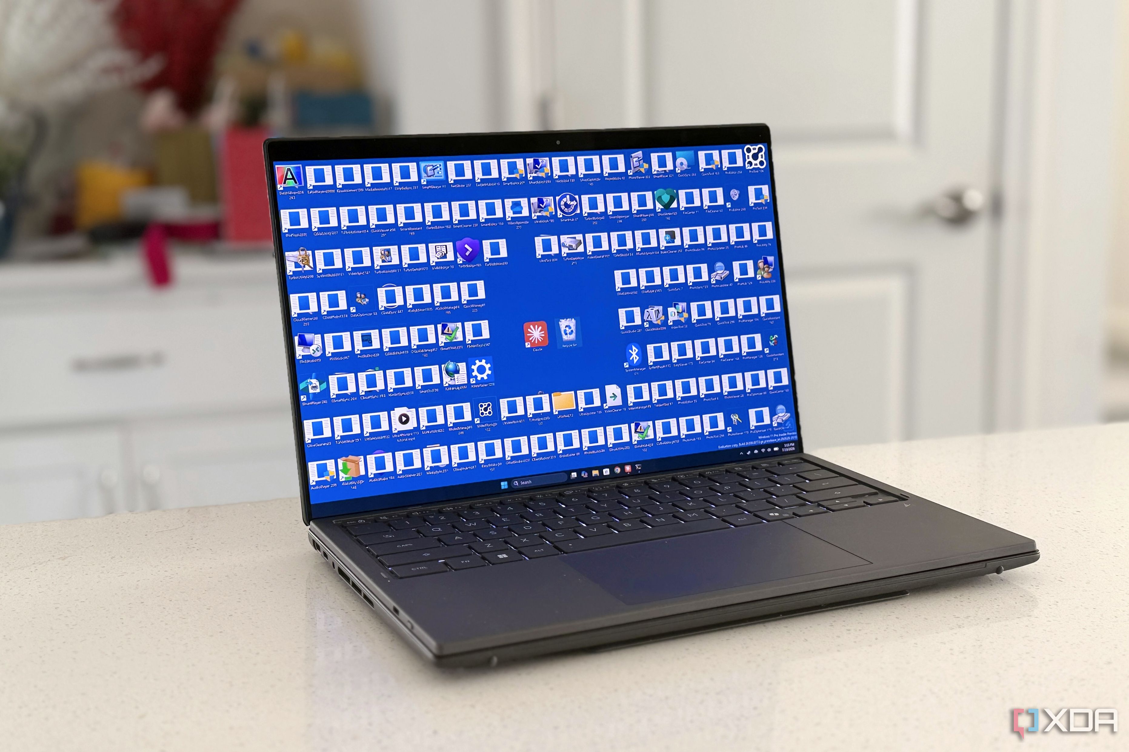 windows 11 desktop with cluttered icons and recycle bin and claude in the center