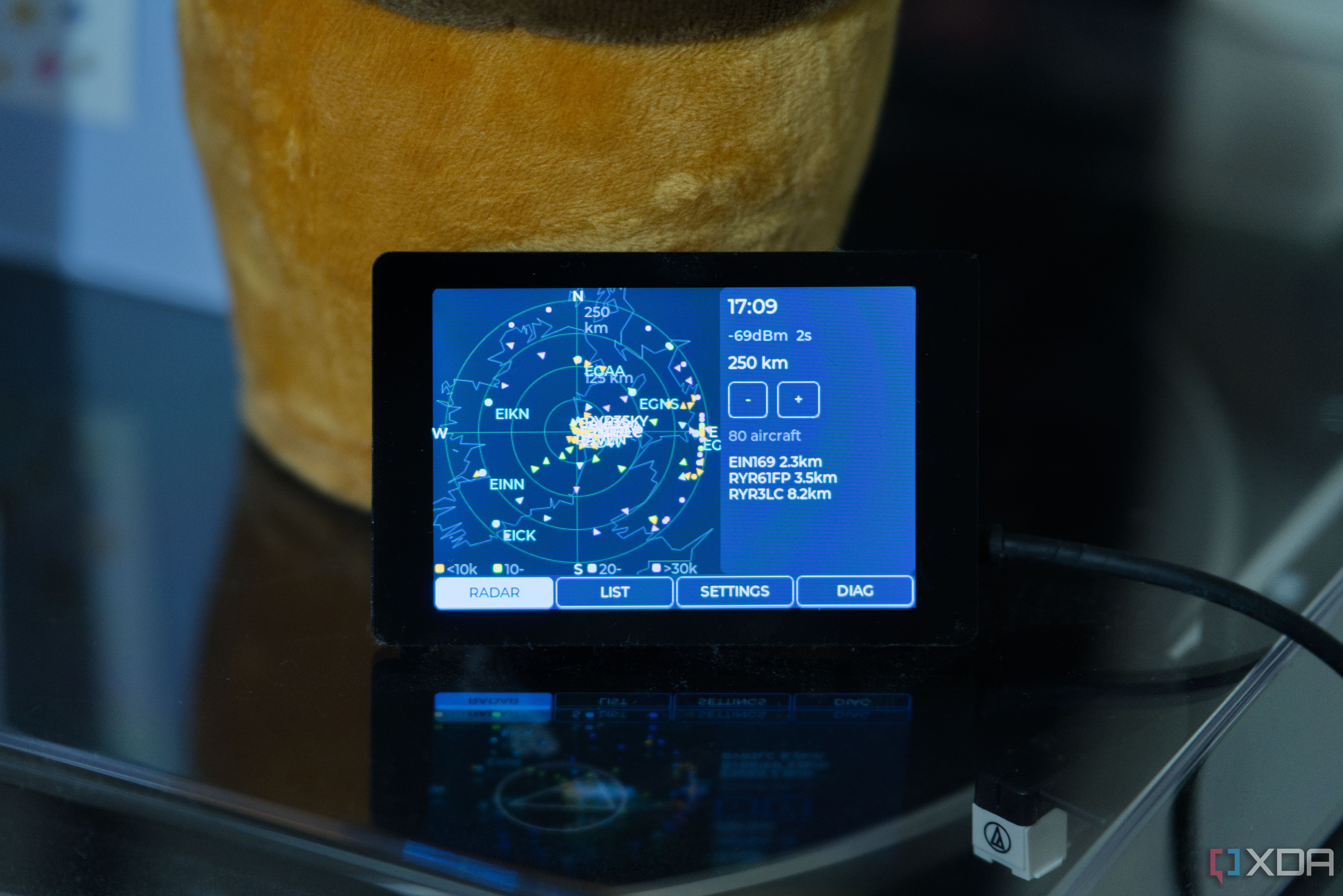 WT32 SC01 Plus ESP32 board showing country coastlines and planes