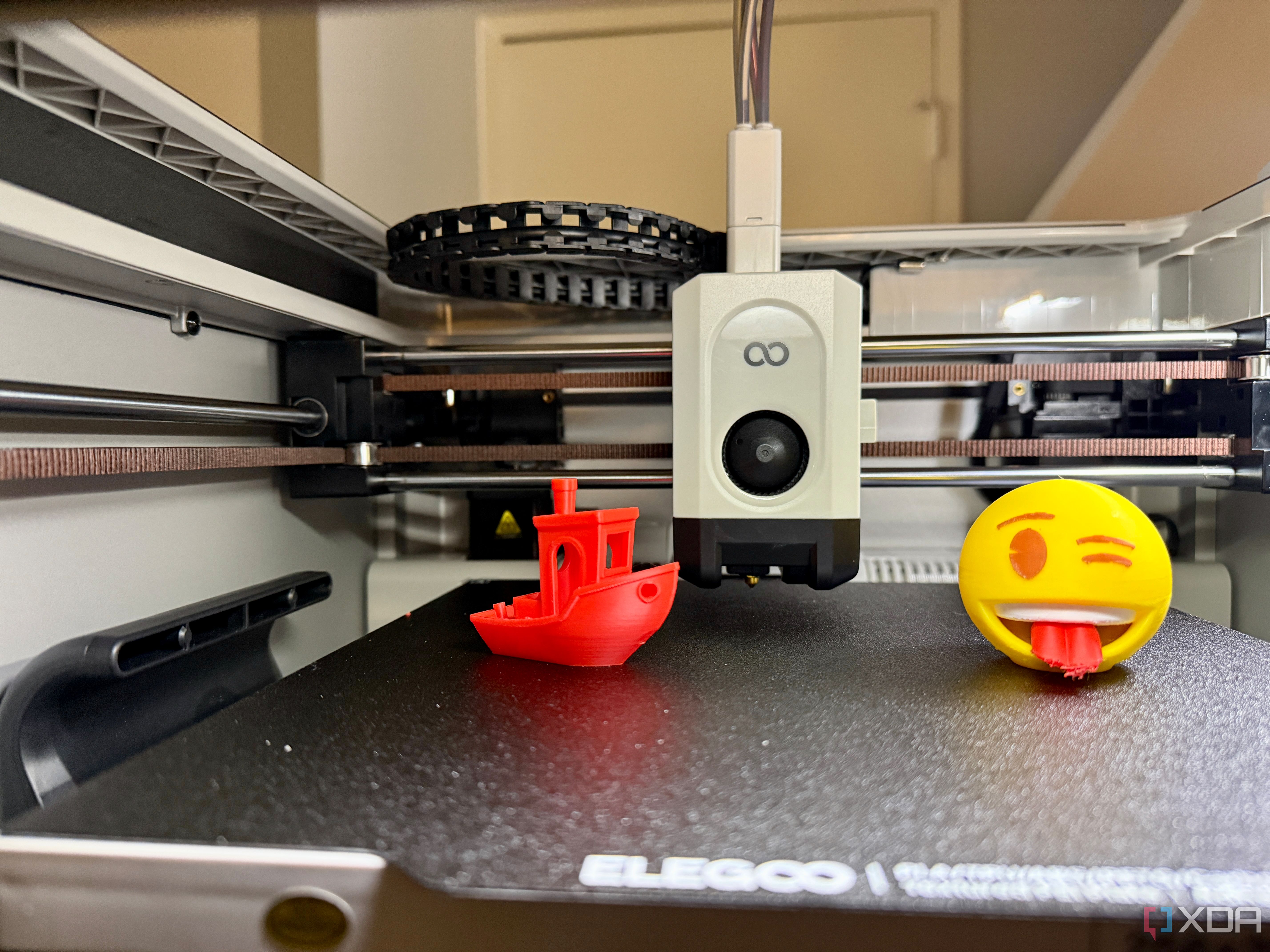 3D printed emoji and Benchy on Elegoo Centauri Carbon 2 Emoji Edition front view