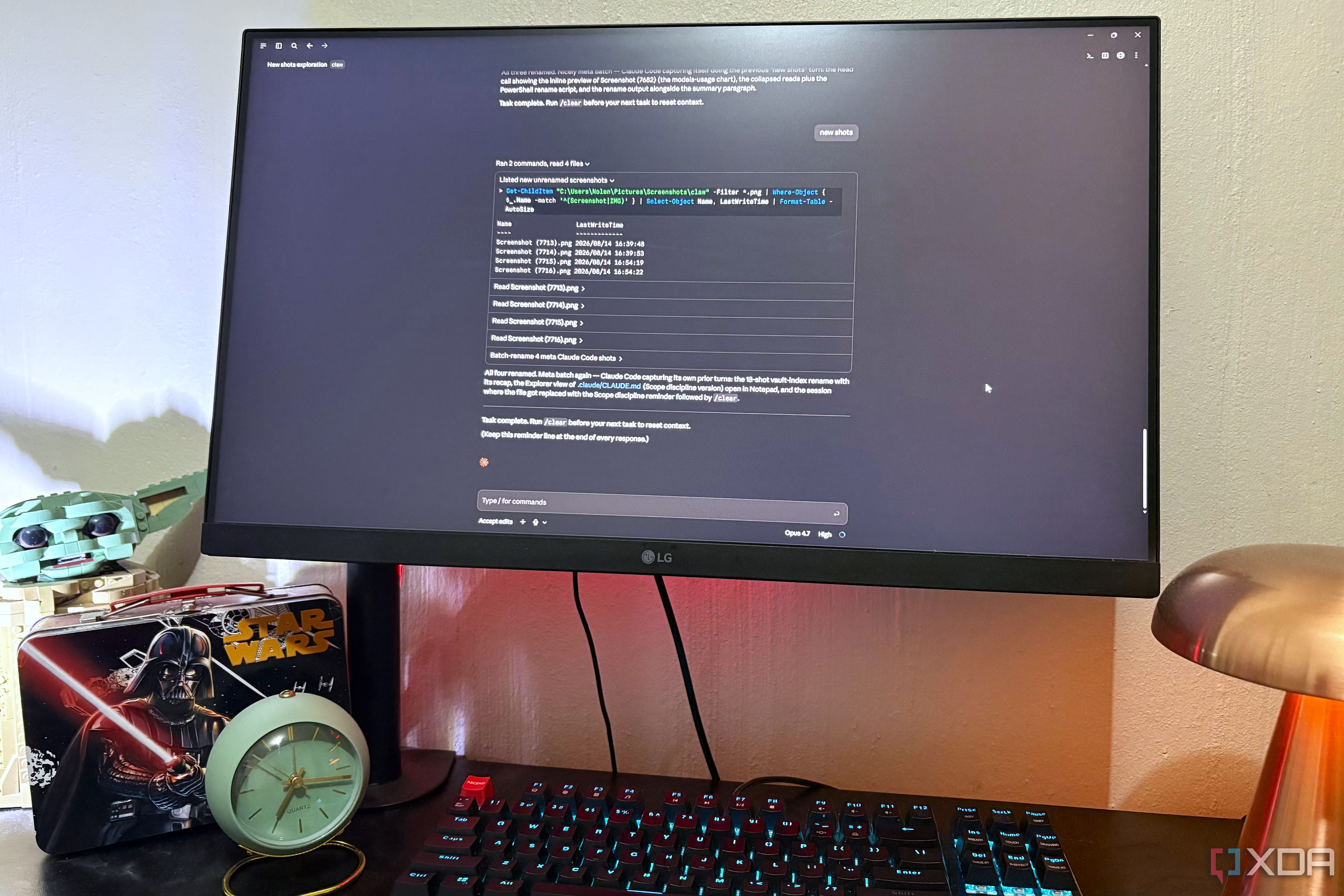 admin work in claude code on desktop pc, lego and lamp in view