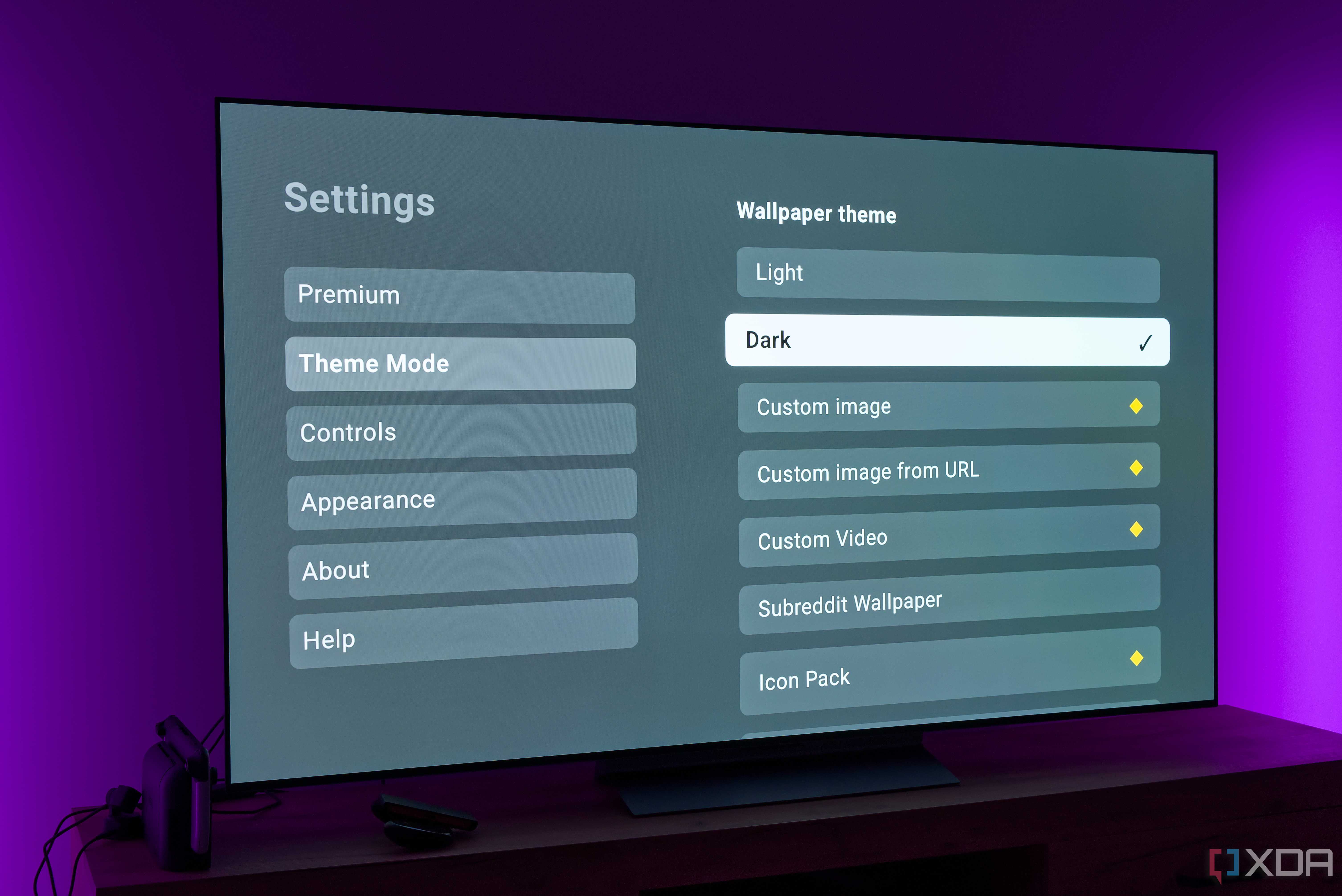 A TV displaying theme settings for the AT4K Launcher for Android TV with the Dark theme option selected