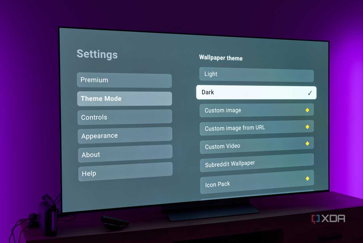 A TV displaying theme settings for the AT4K Launcher for Android TV with the Dark theme option selected