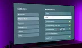 A TV displaying theme settings for the AT4K Launcher for Android TV with the Dark theme option selected