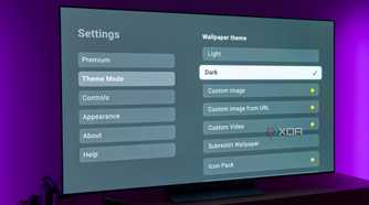 A TV displaying theme settings for the AT4K Launcher for Android TV with the Dark theme option selected
