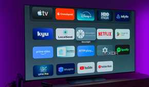 A TV showing the home page on the AT4K Launcher, showing a list of apps on a dark background