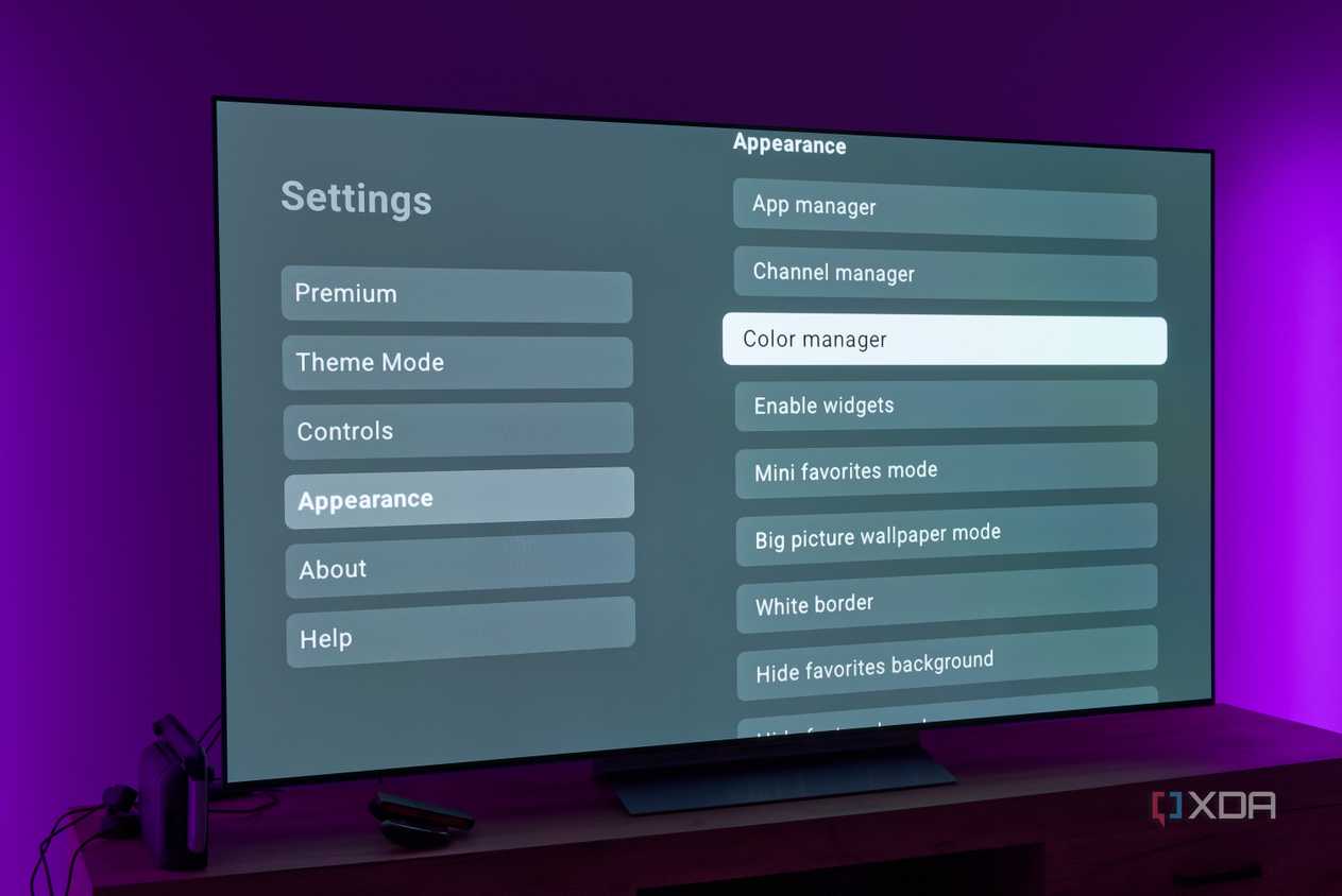 A TV displaying various appearance settings for the AT4K Launcher for Android TV
