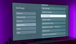 A TV displaying various appearance settings for the AT4K Launcher for Android TV