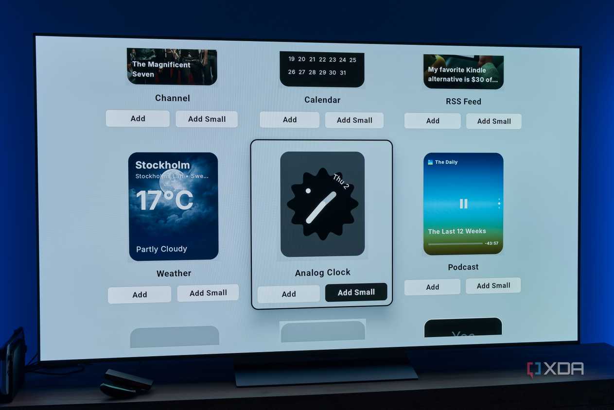 A TV showing more widgets that can be added to the AT4K Launcher homepage, including weather, an analog clock, and a podcast