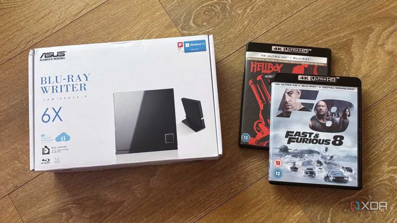 A Blu-ray writer beside physical Blu-Ray movies