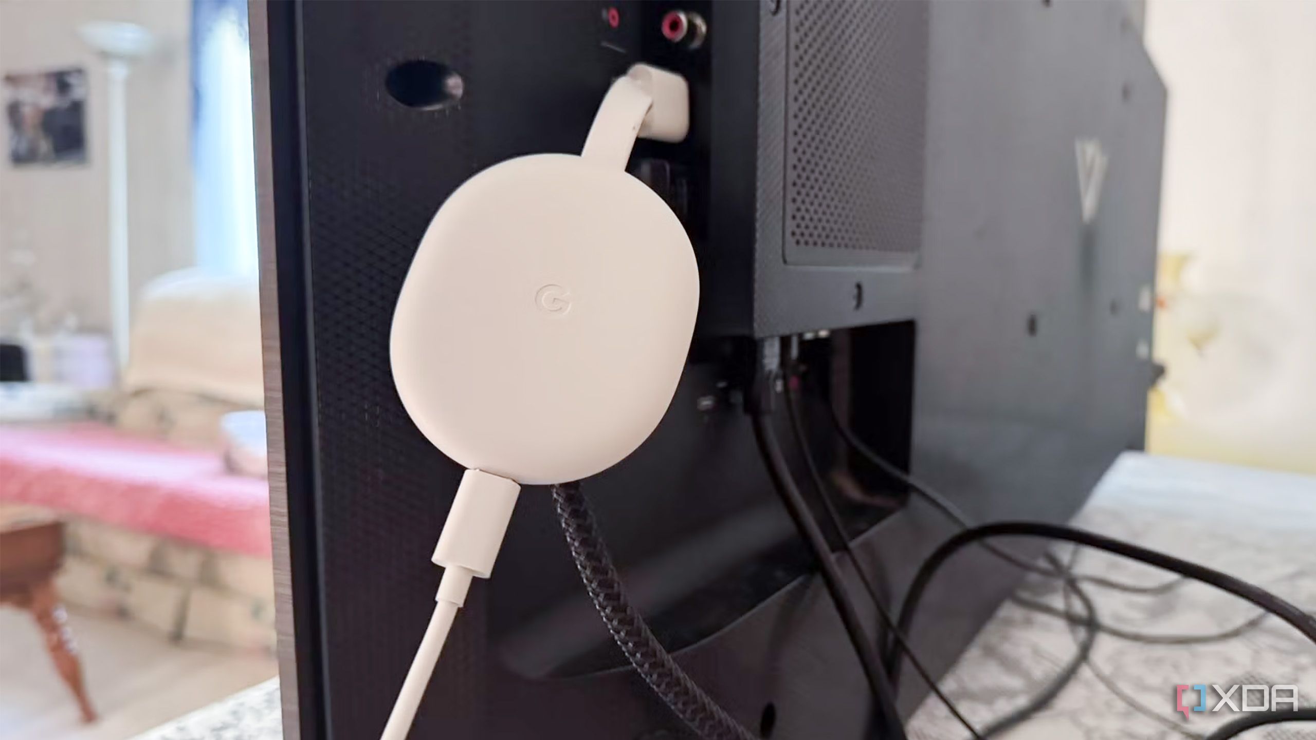 Old Chromecast with Google TV Plugged into Smart TV