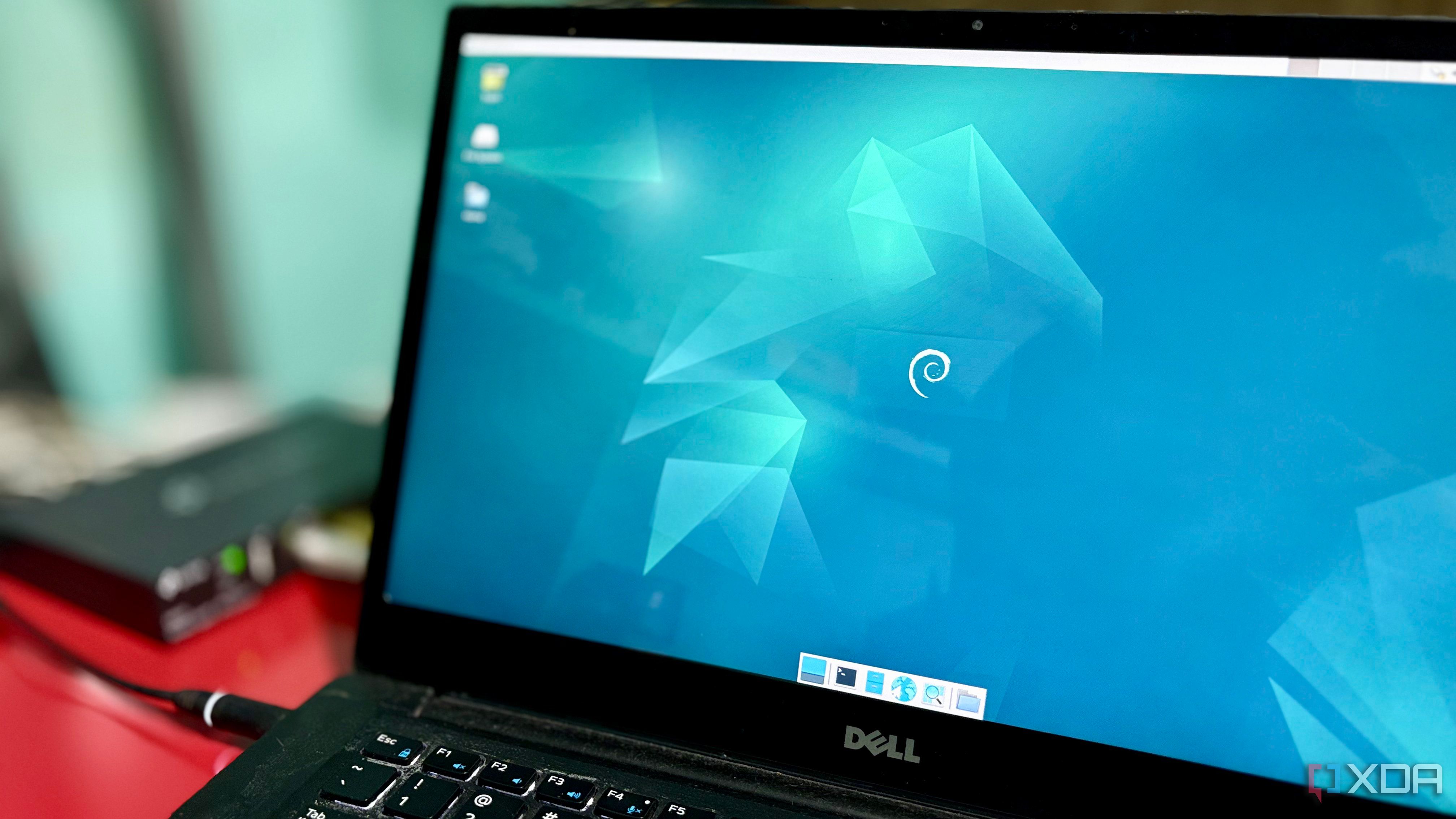 A Dell Latitude laptop running Debian, repurposed as a home server