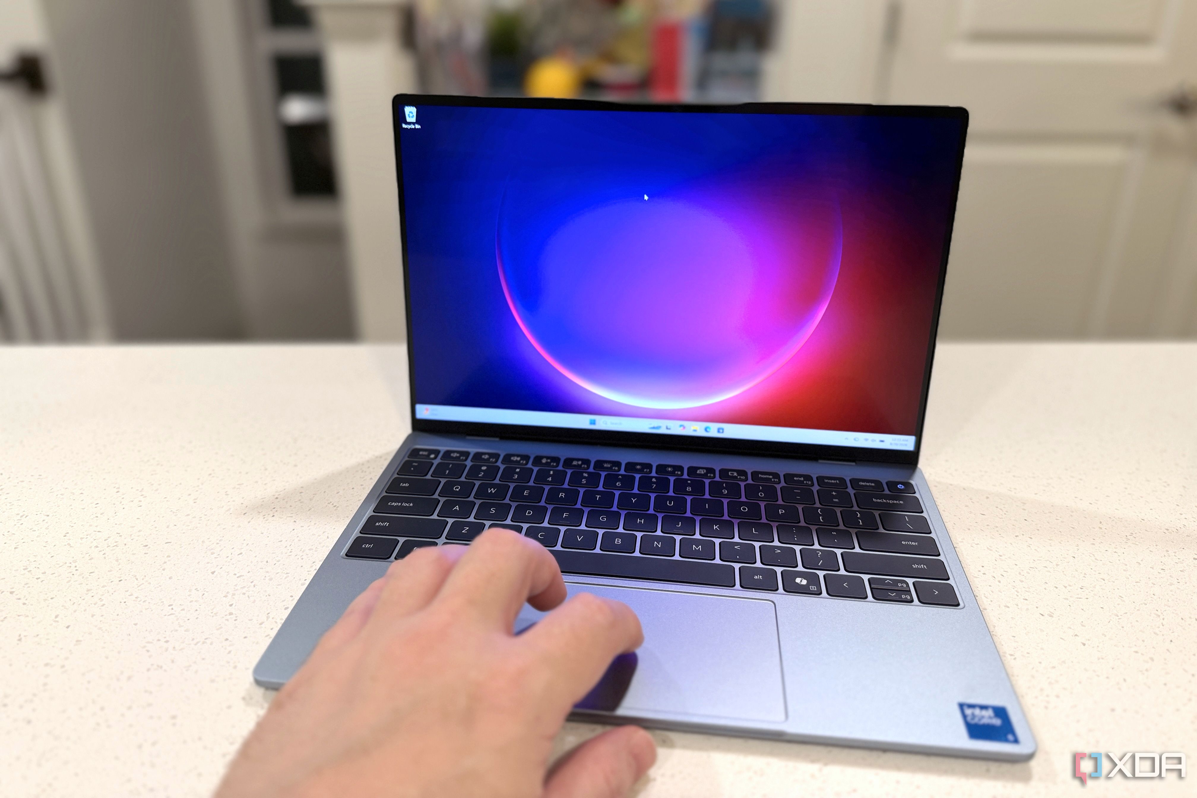 dell xps 13 showing a hand using the touchpad