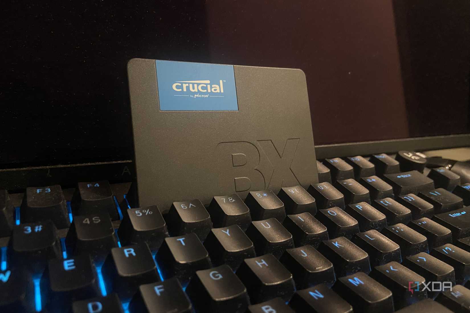 An image of a Crucial BX 500 SATA 3 SSD on a keyboard.