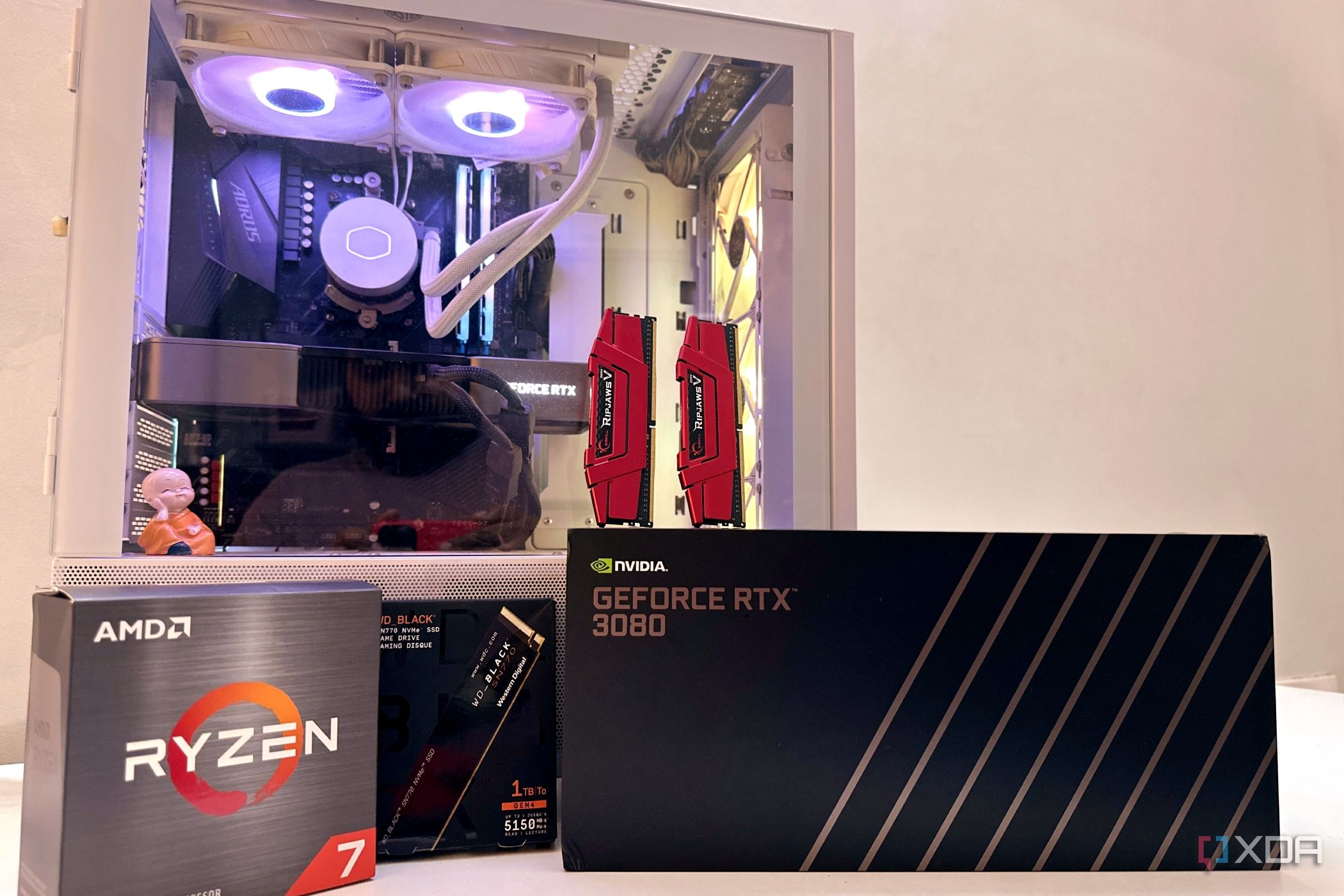 Gaming PC with upgradable components in boxes.