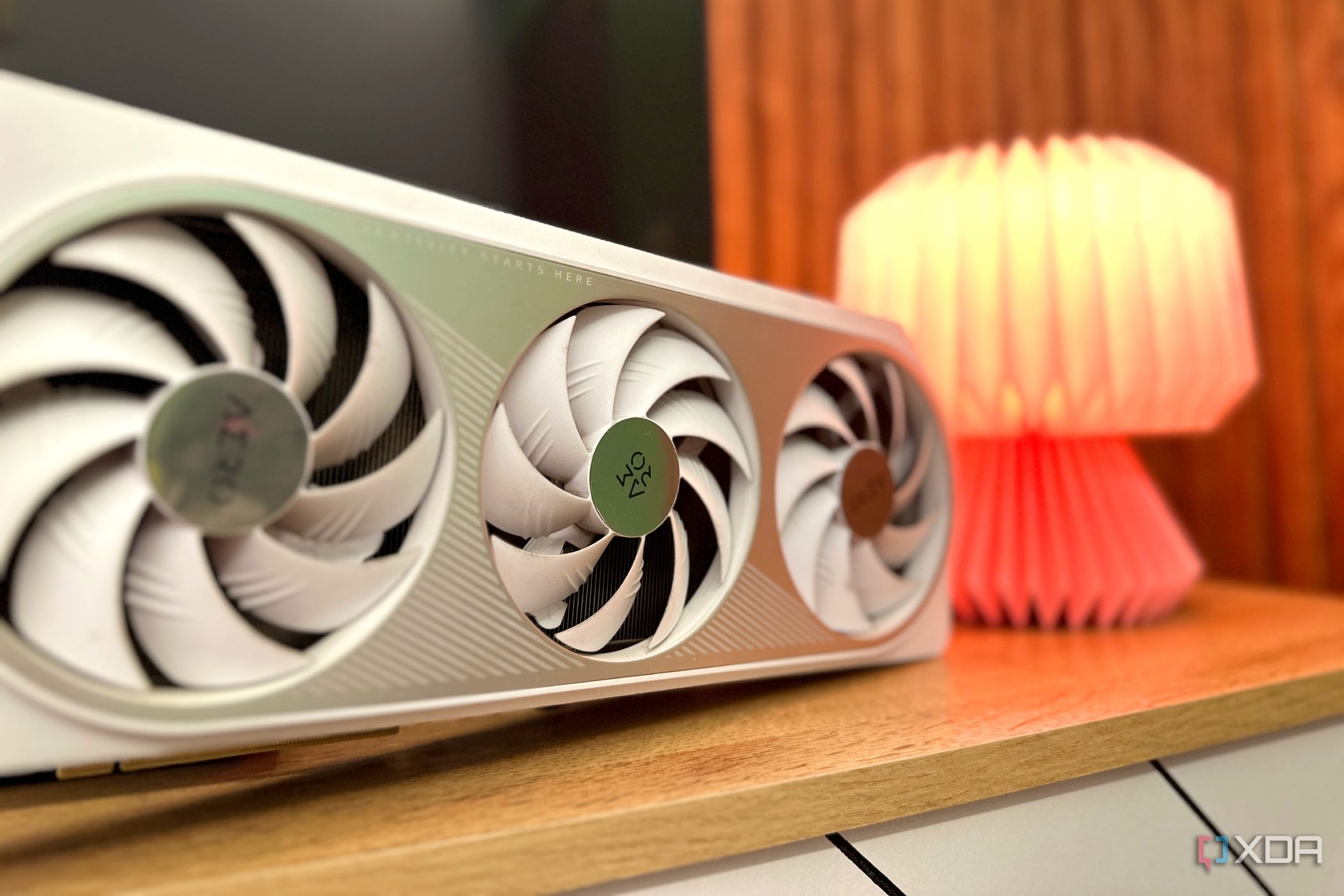 Gigabyte's Nvidia GeForce RTX 4070 Ti GPU next to an origami lamp.