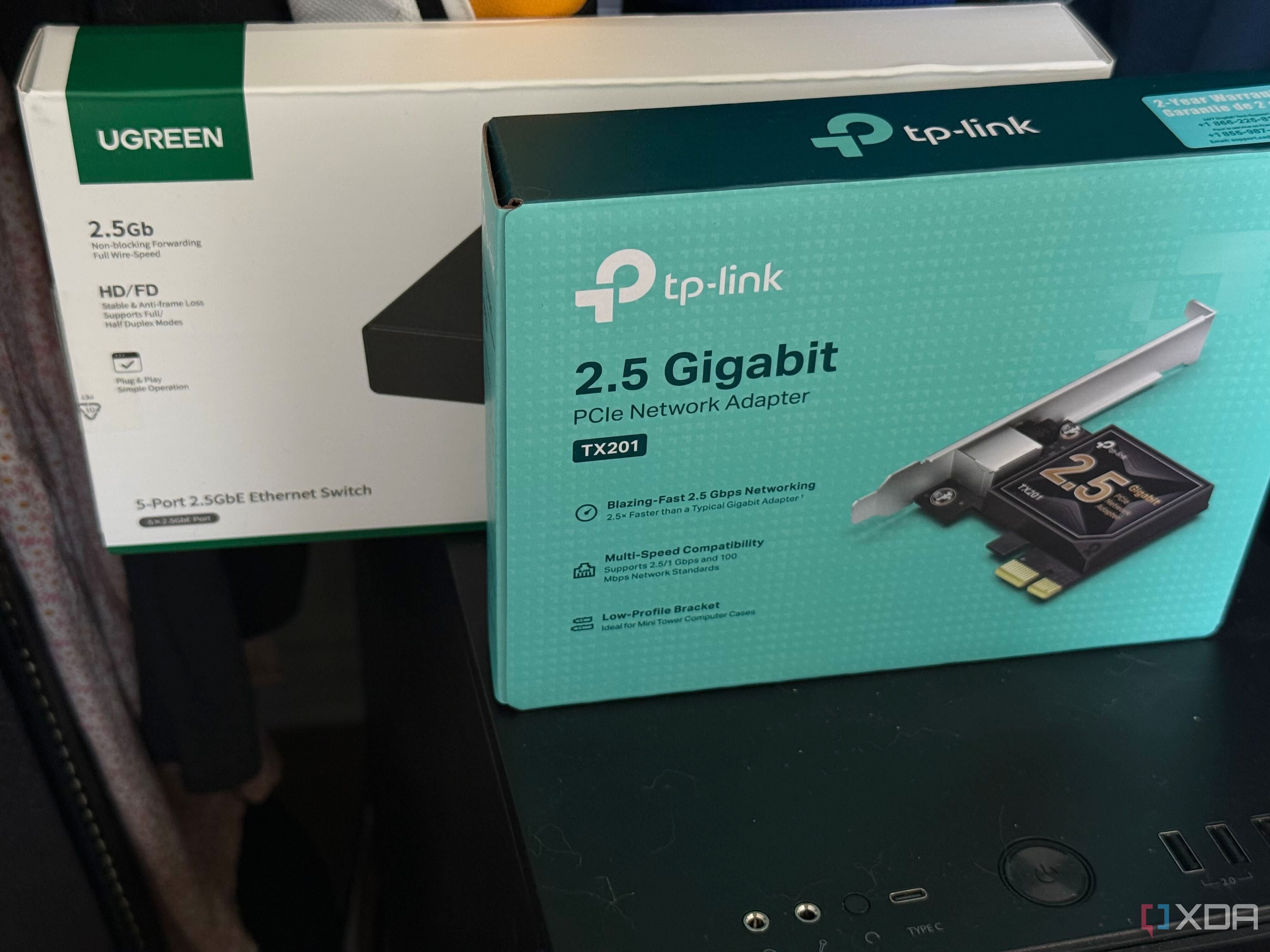 A photo of two multi-gig devices on top of a PC case