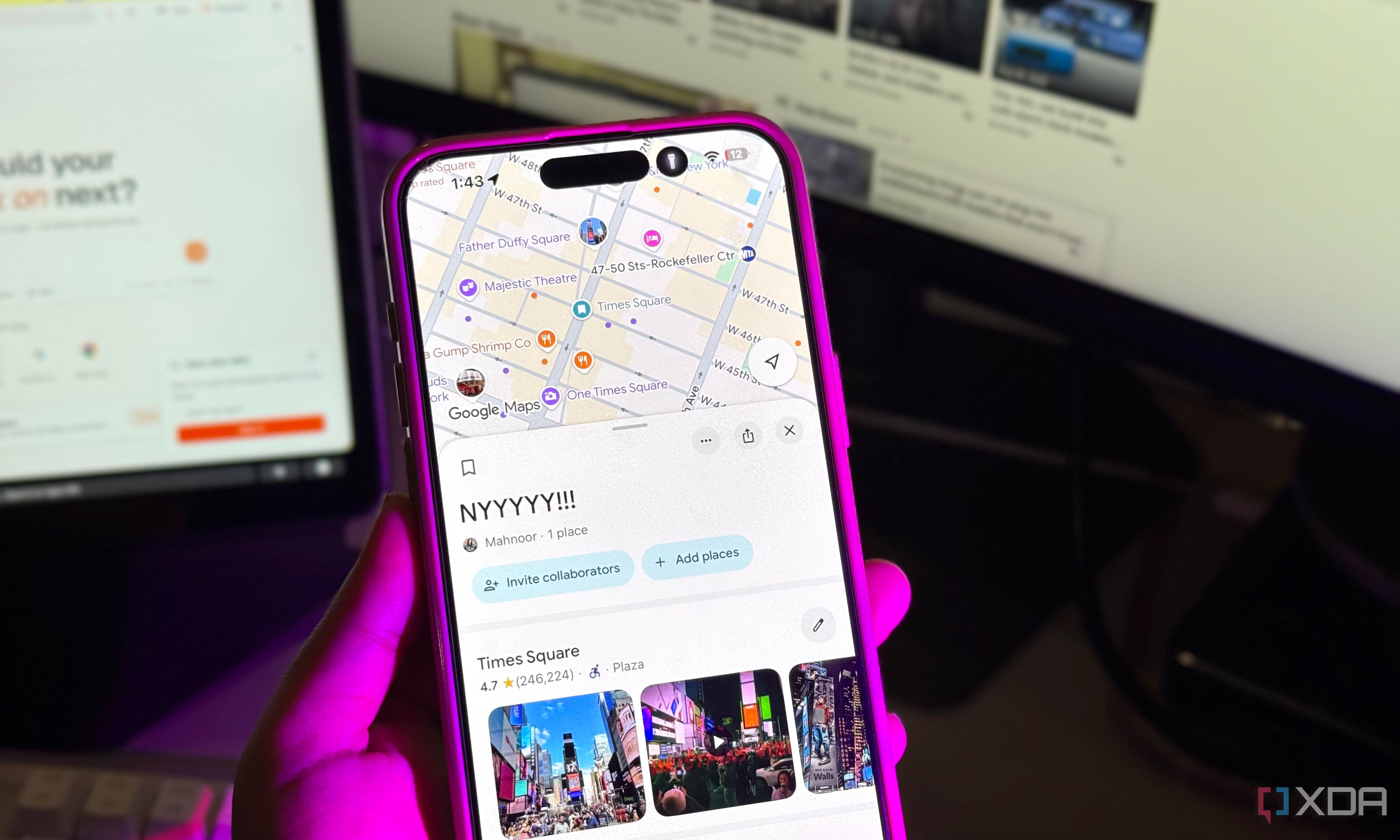 iPhone in hand displaying Google Maps NYYYYY!!! list, monitors glowing behind it