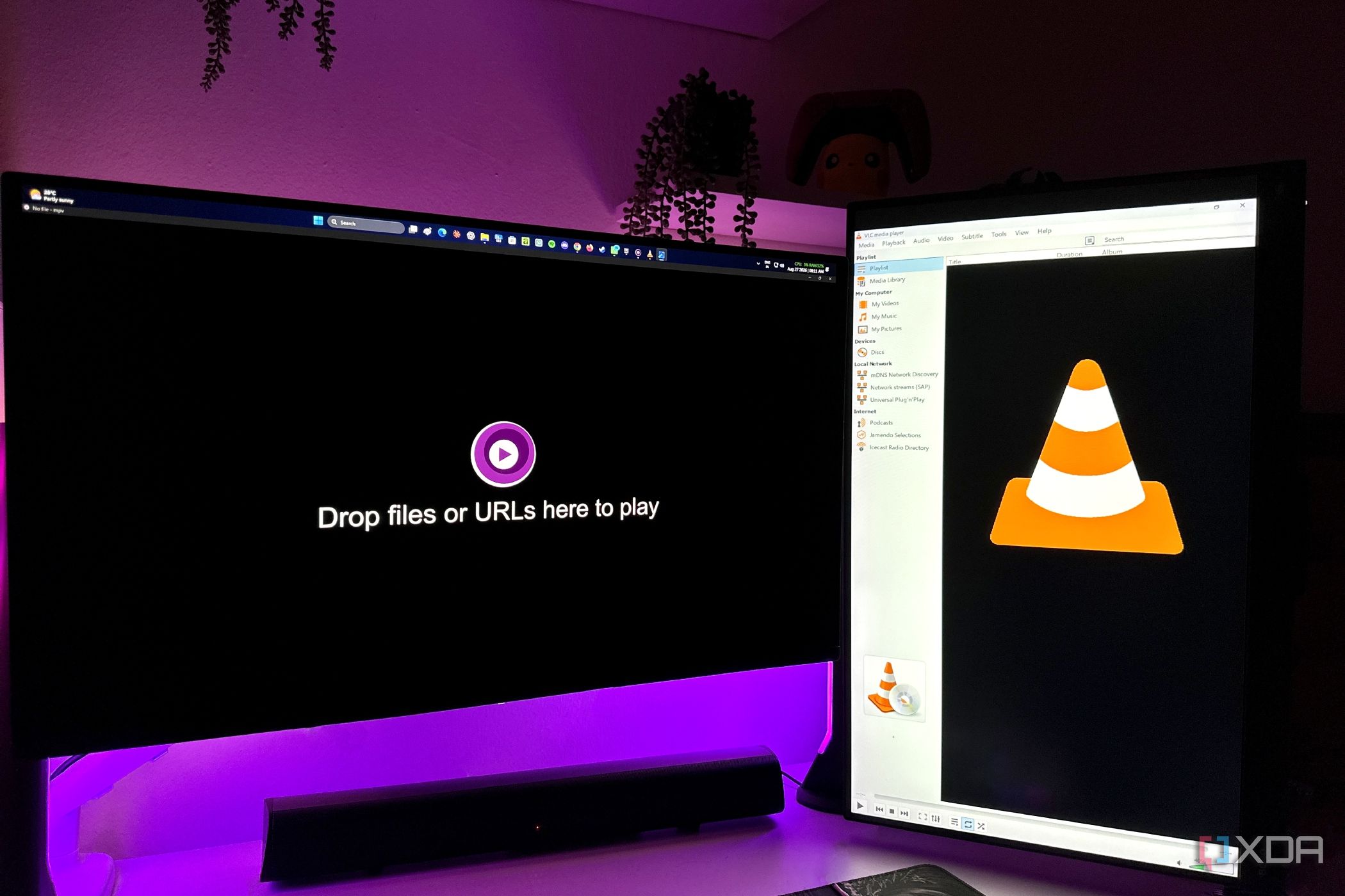 MPV media player and VLC media player on a dual-monitor setup.