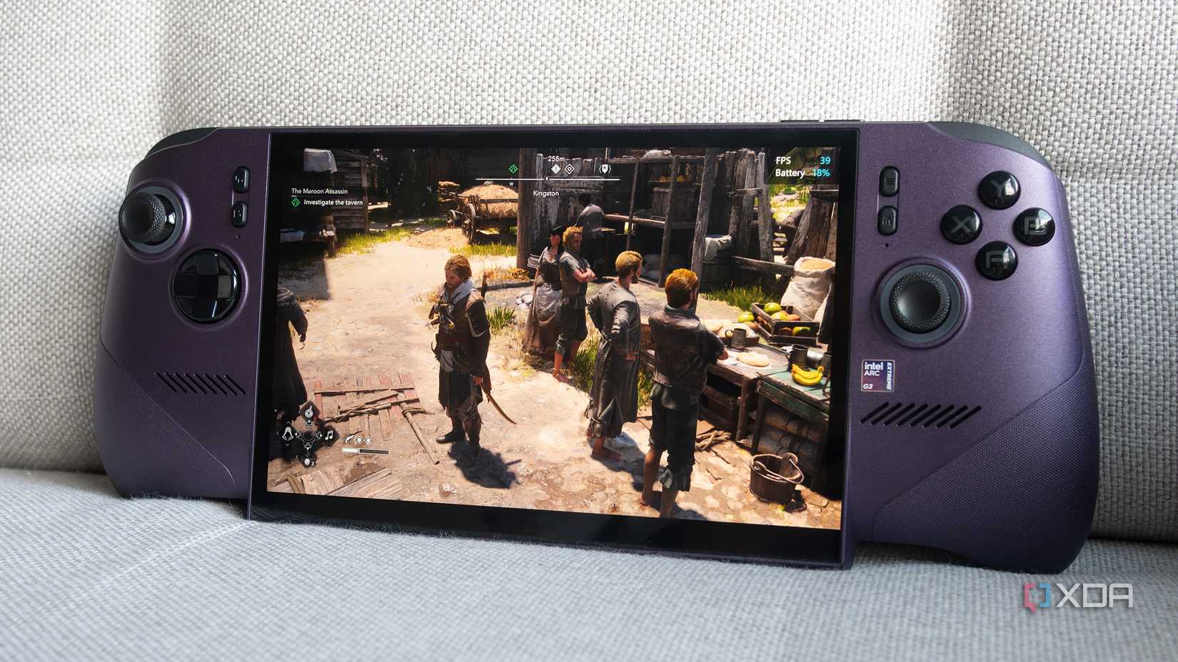 The MSI Claw 8 EX AI+ is sitting on the couch with Black Flag resyncing on top of it. 