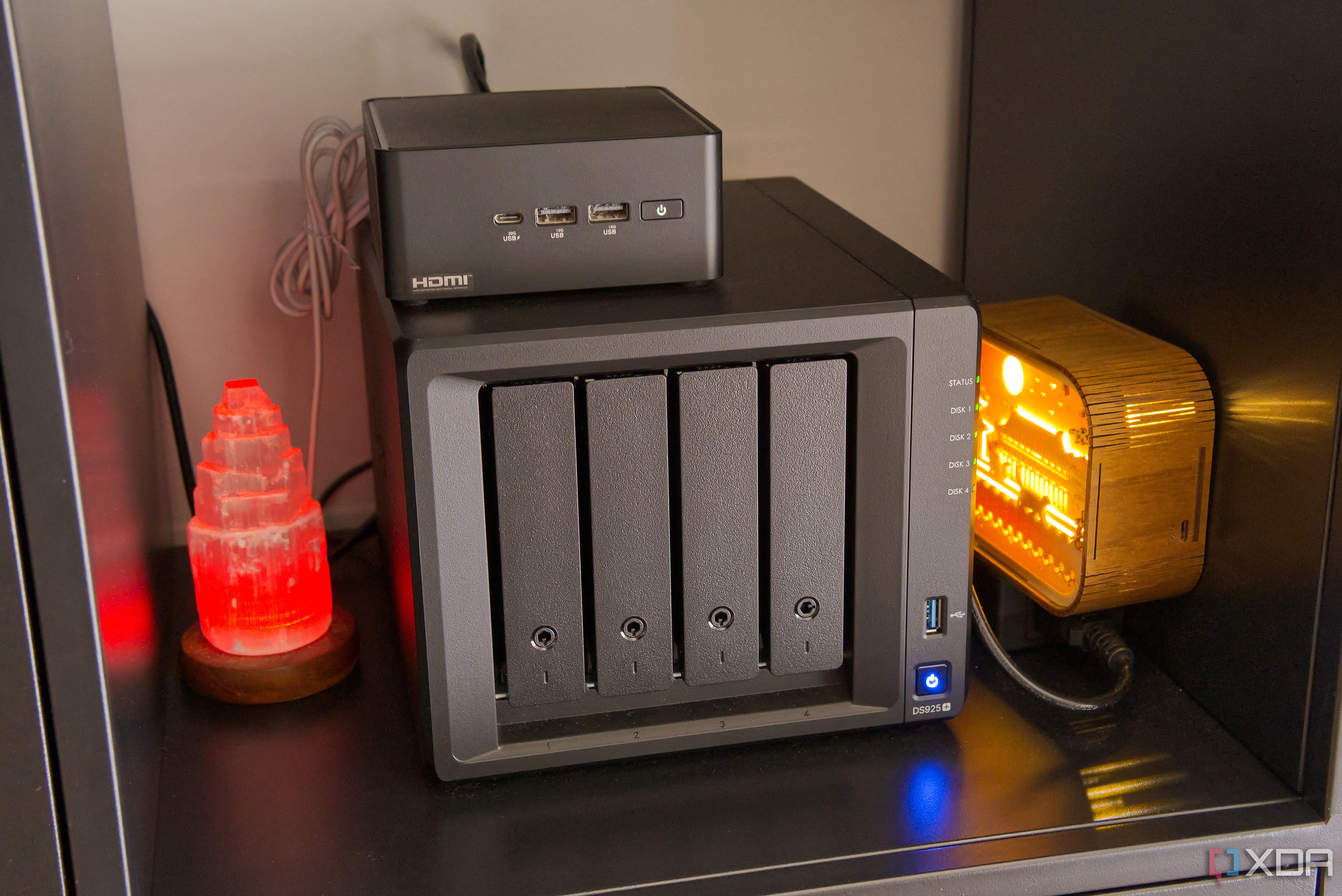 A mini PC on top of a NAS enclosure