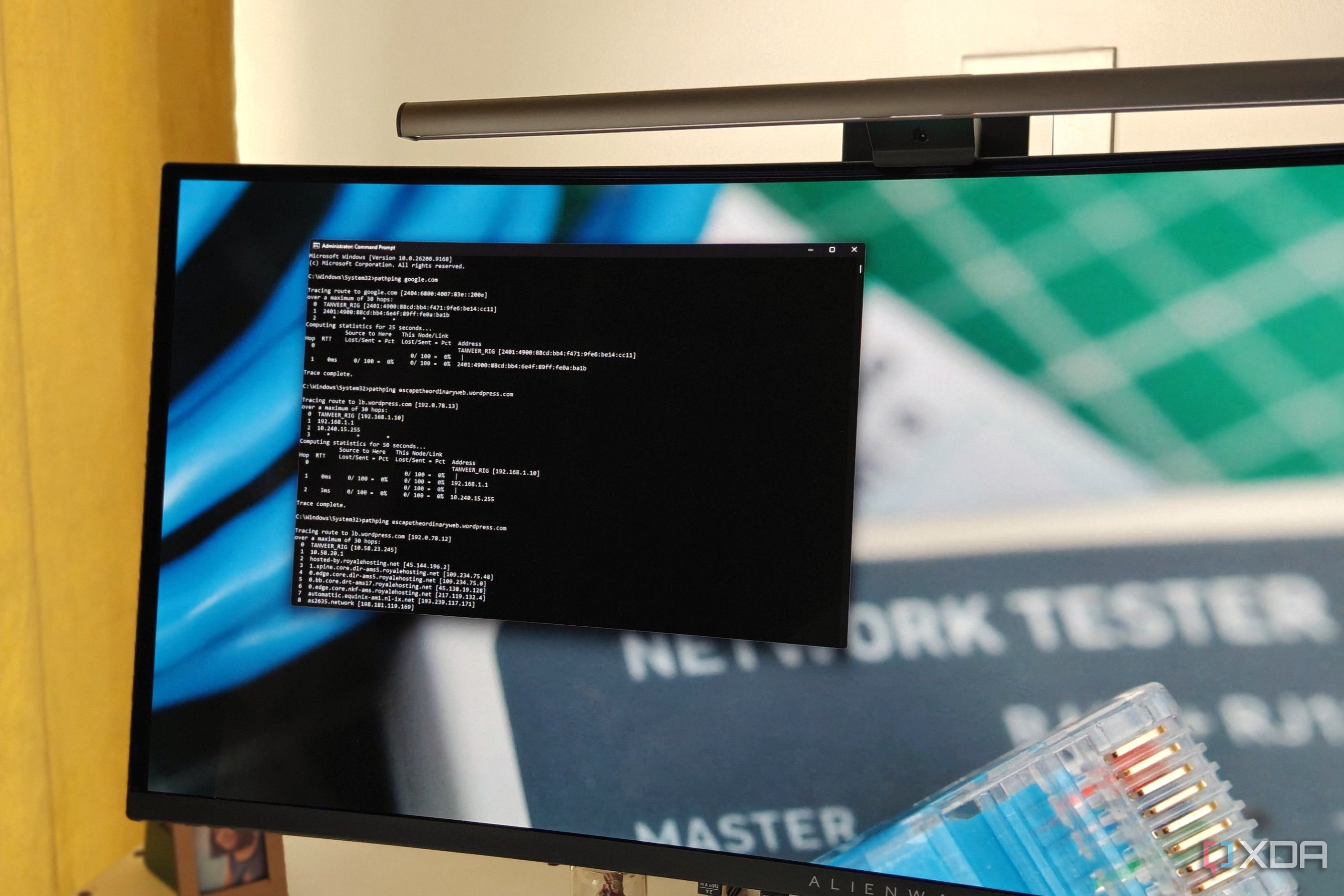 An ultrawide monitor with a light bar showing a Command Prompt window