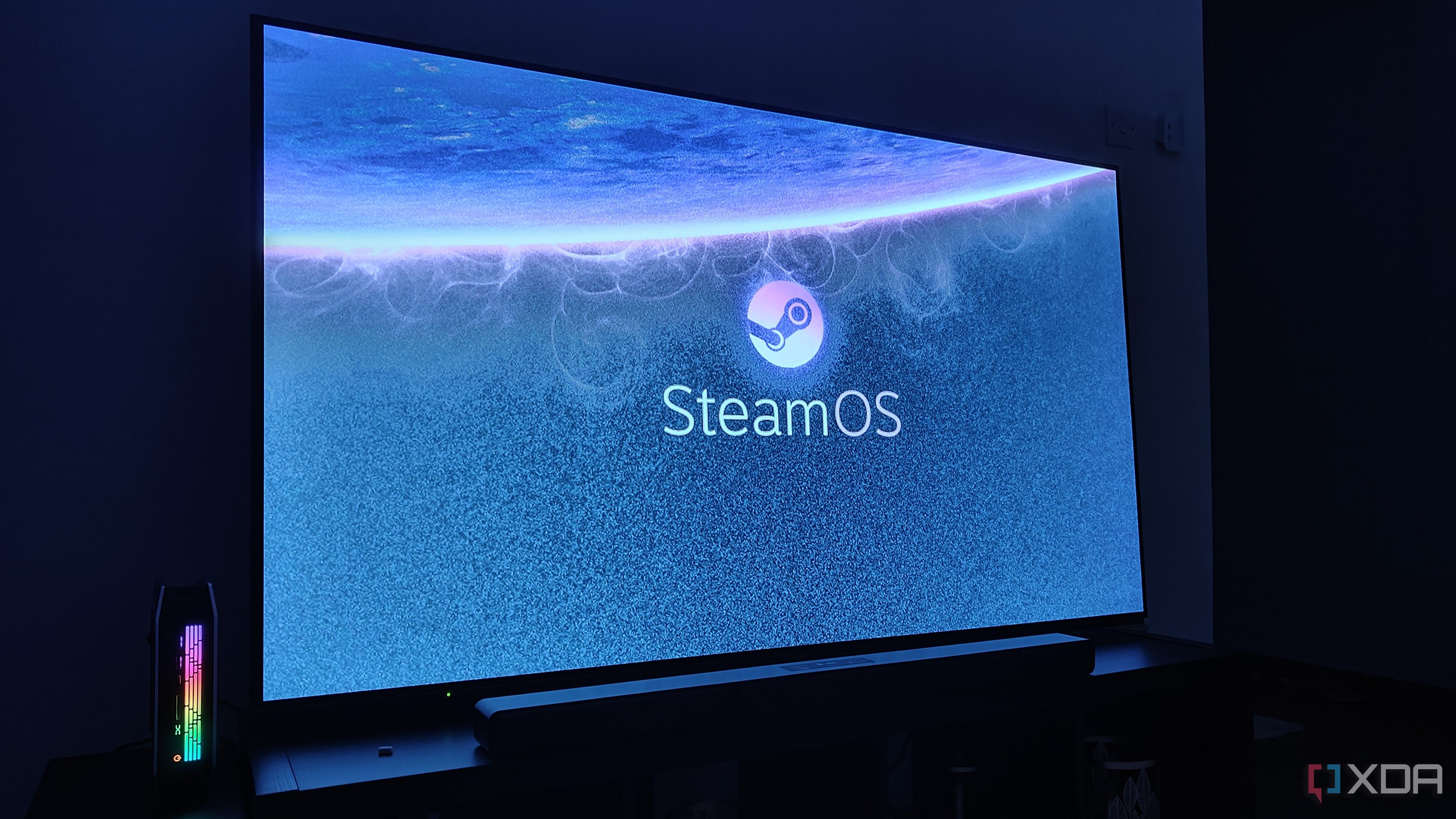 A mini PC being used with SteamOS as a living room console replacement. A soundbar is visible on the TV console.