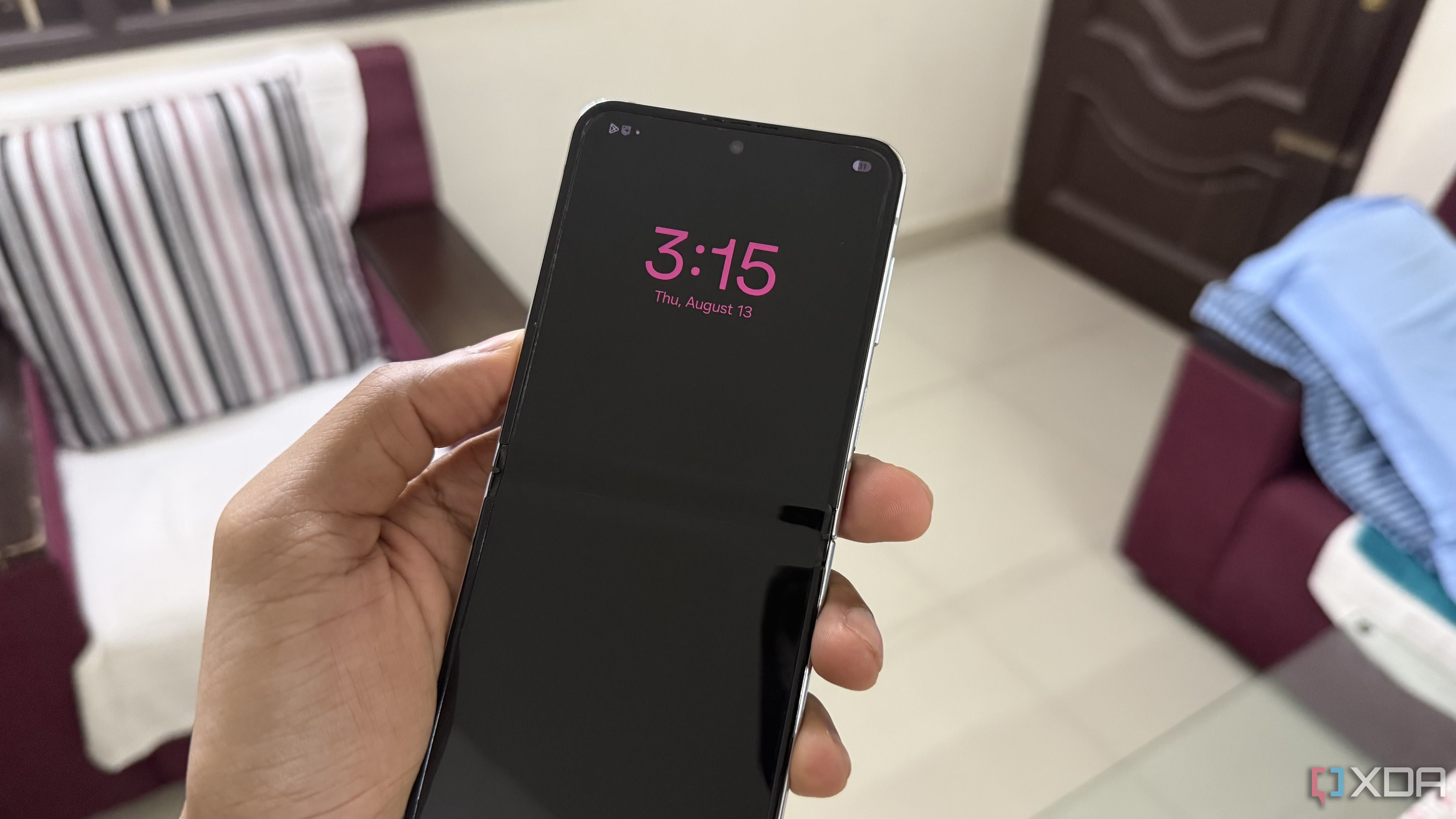 Samsung Galaxy Z Flip 5 in hand showing Always On Display