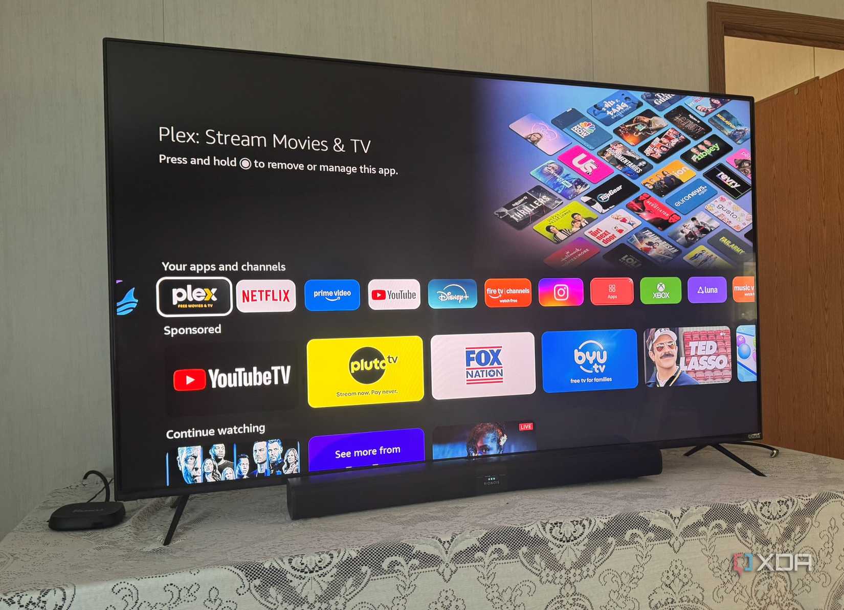 Shows Fire TV Stick with Vega OS Home Screen Apps Row