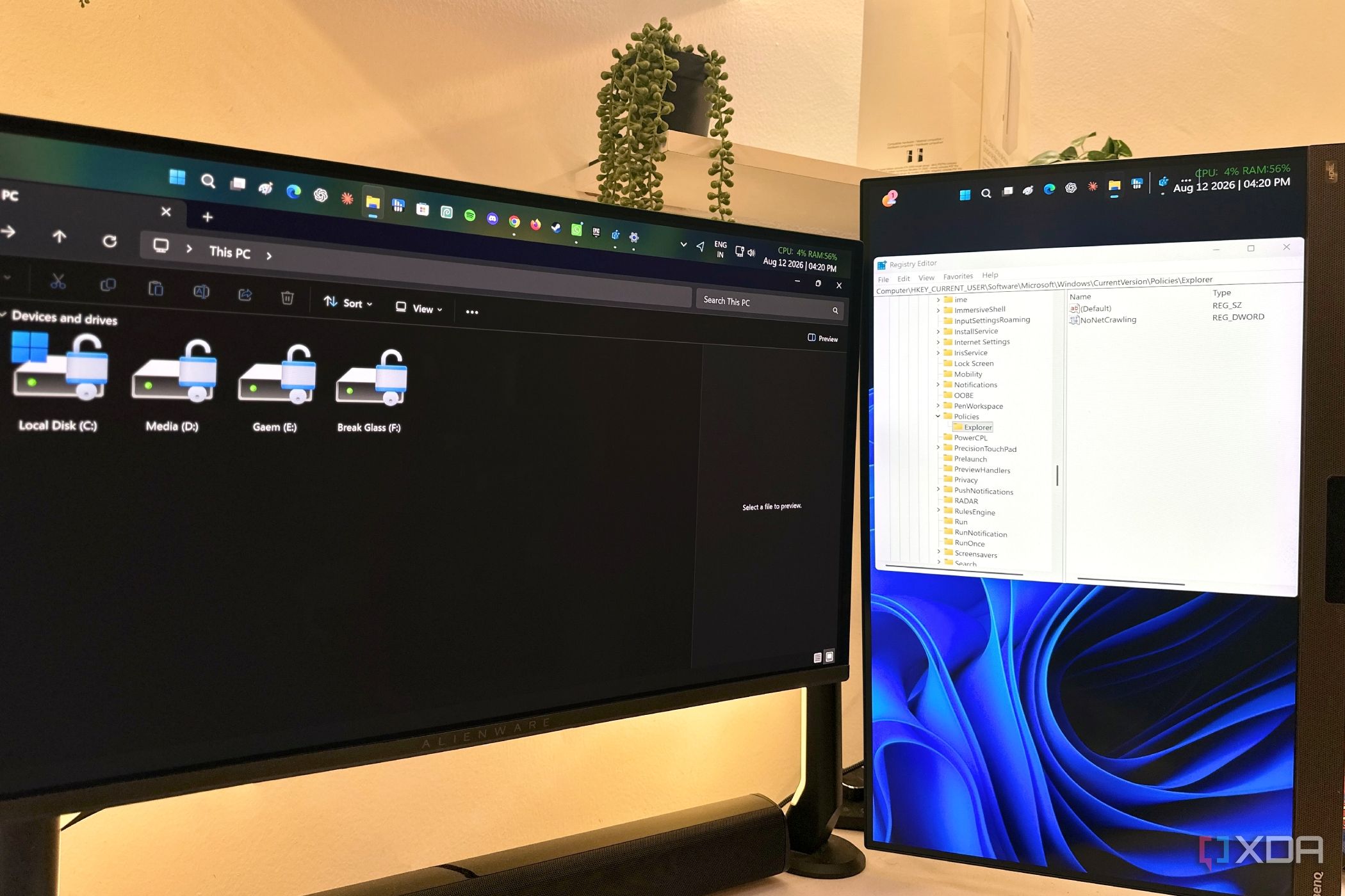 Windows 11 File Explorer and Registry Editor on dual-monitor setup.