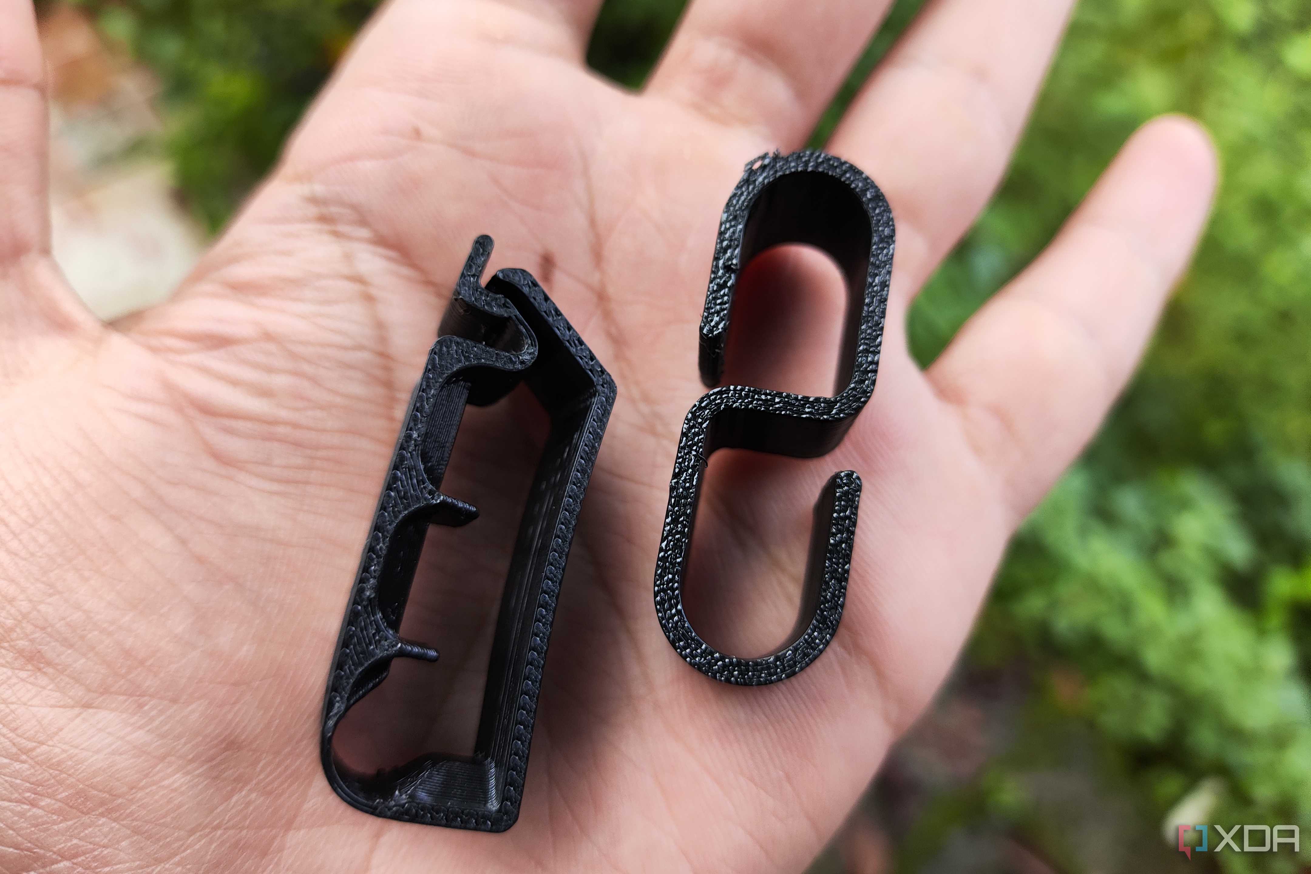 Two 3D printed cable clips