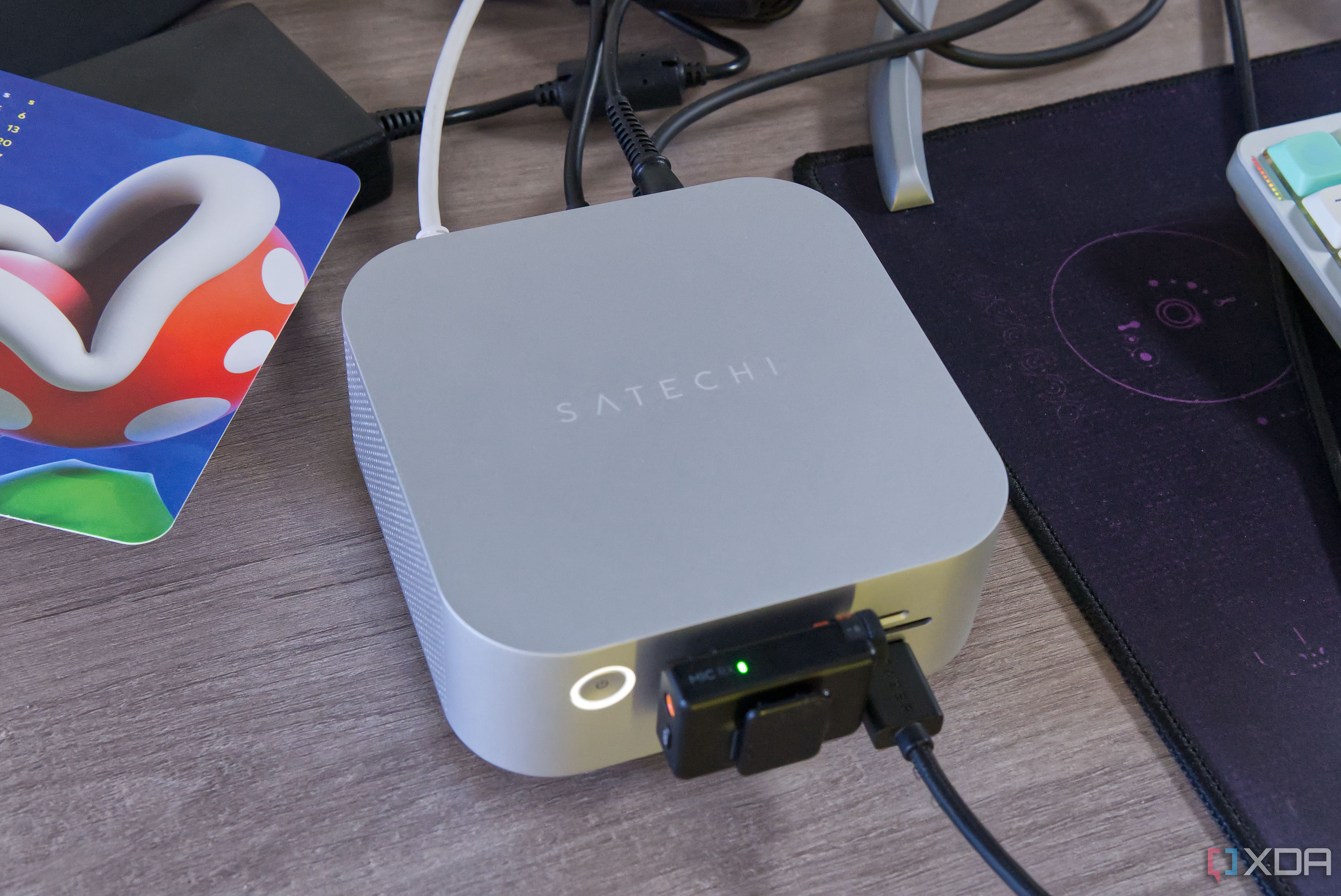 A Satechi Thunderbolt 5 CubeDock with multiple peripherals connected to its ports