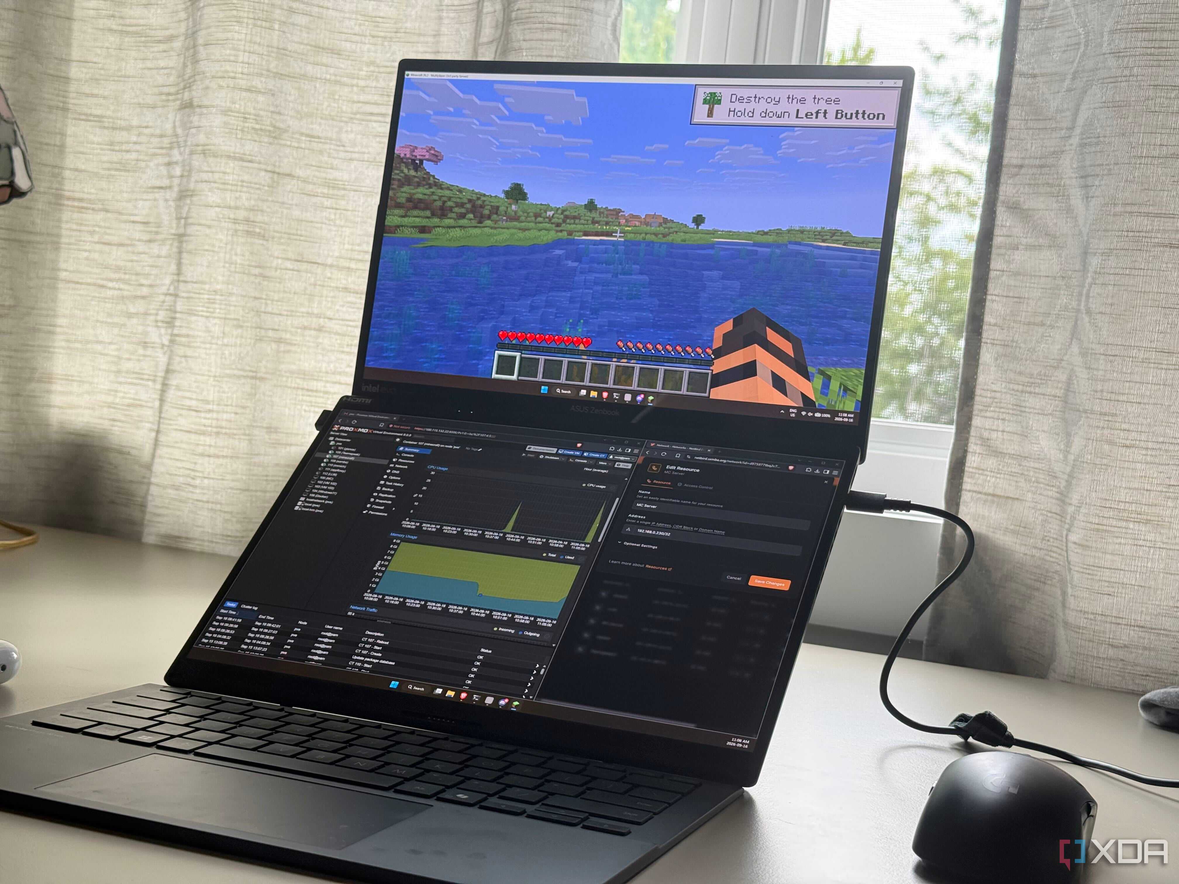 A laptop showing minecraft running alongside the proxmox webui