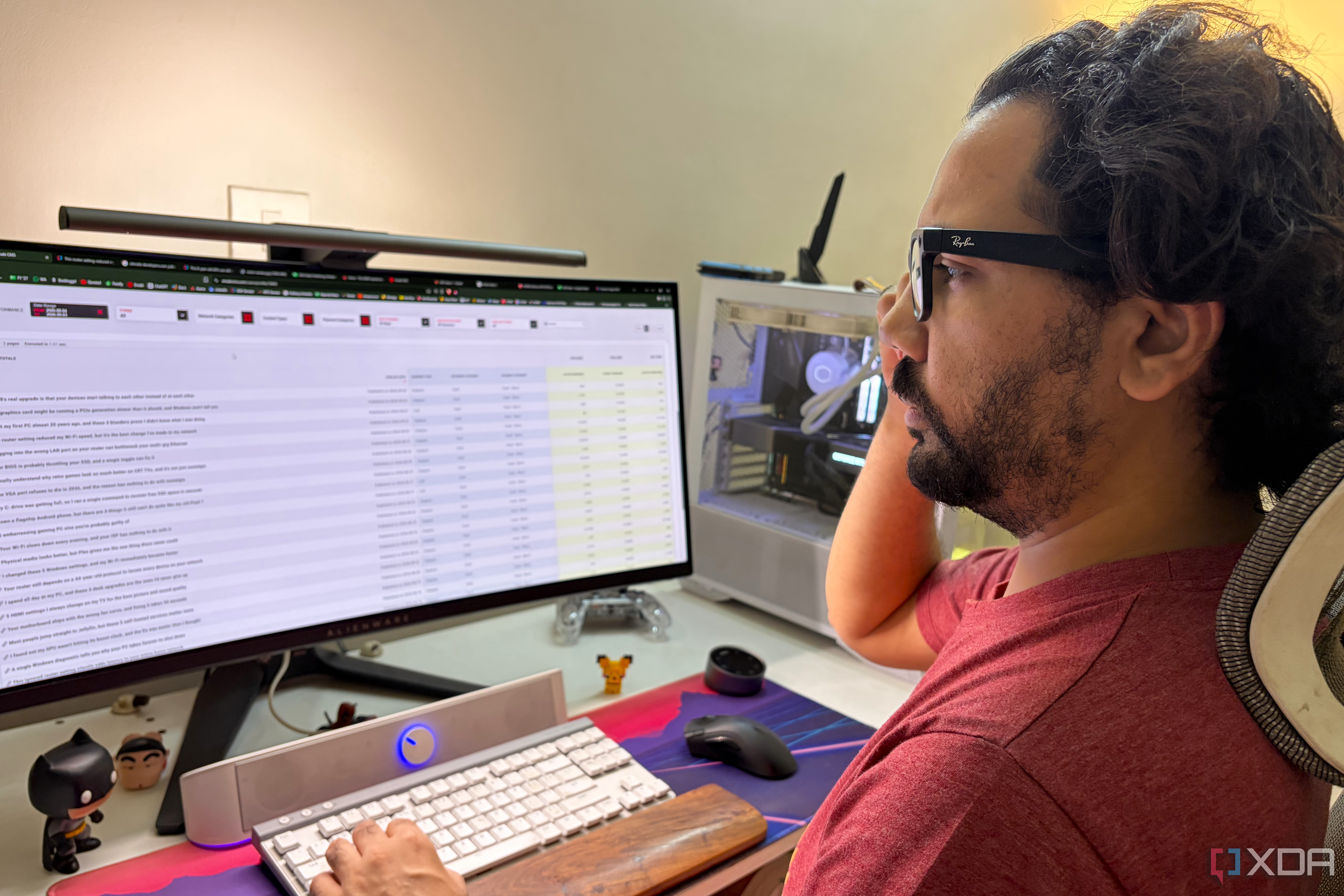 A person wearing smart glasses and looking at a PC setup