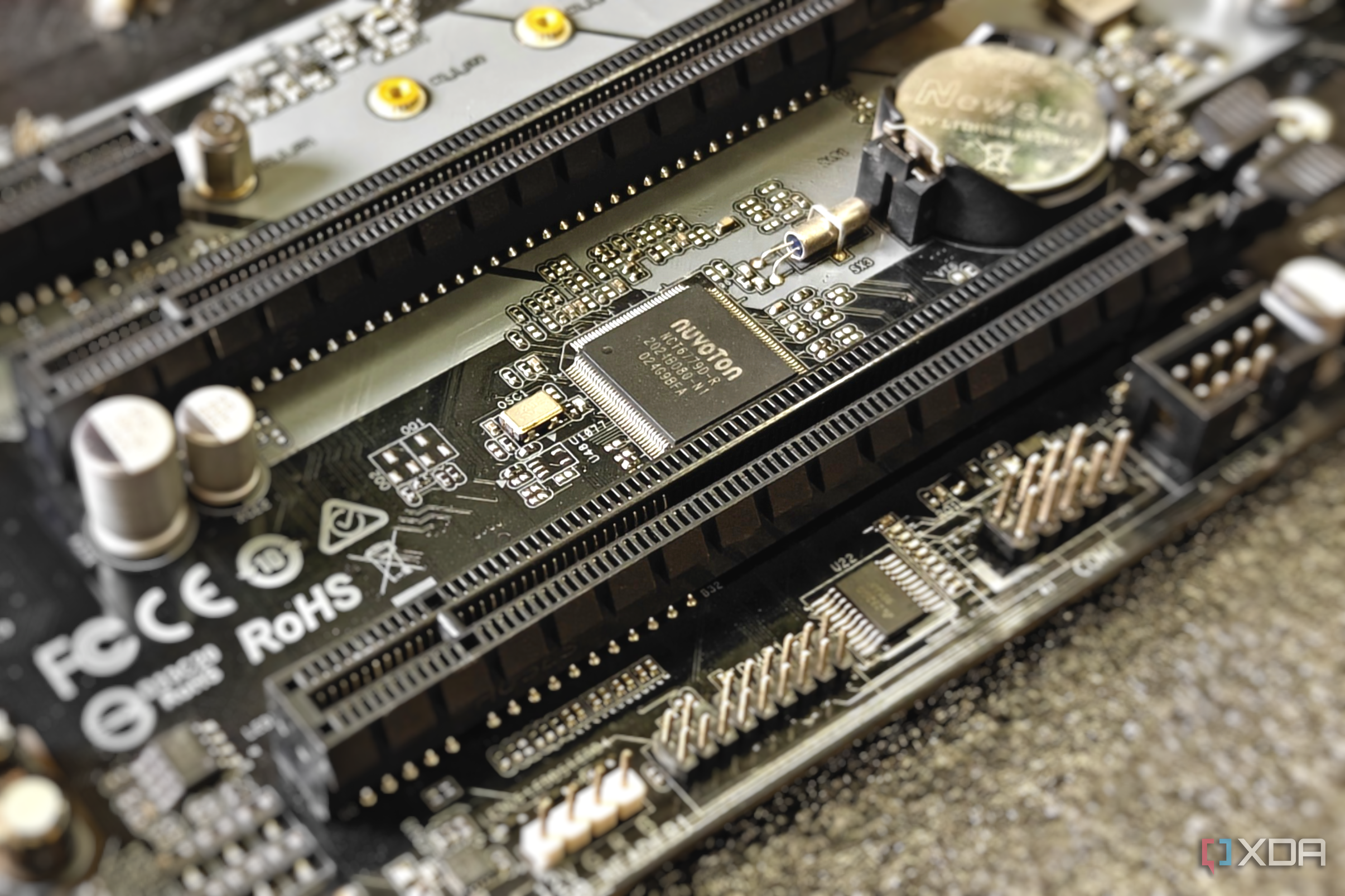 Close-up of a motherboard showing an integrated chip next to PCIe slots