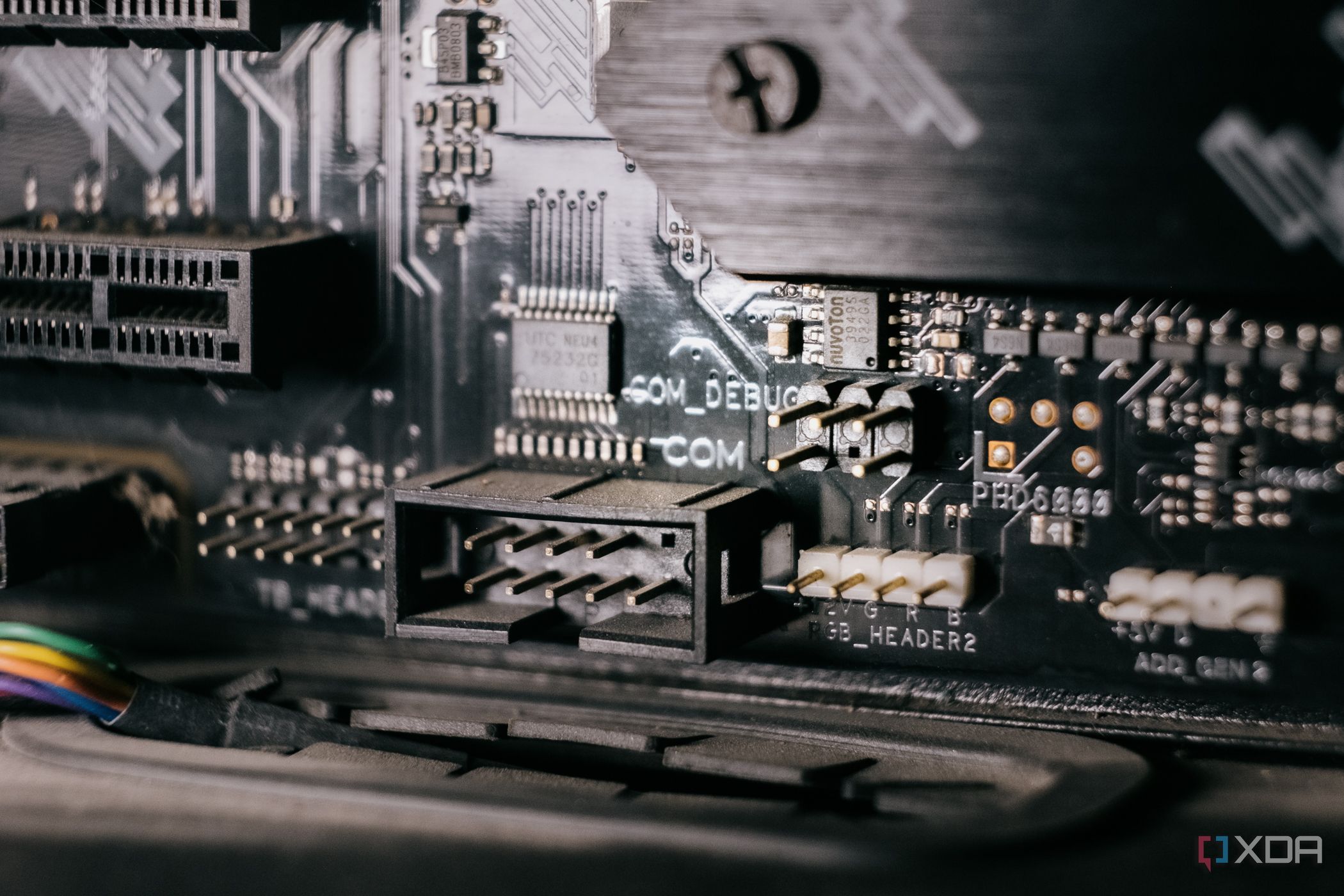 Close-up of a motherboard showing a serial port header