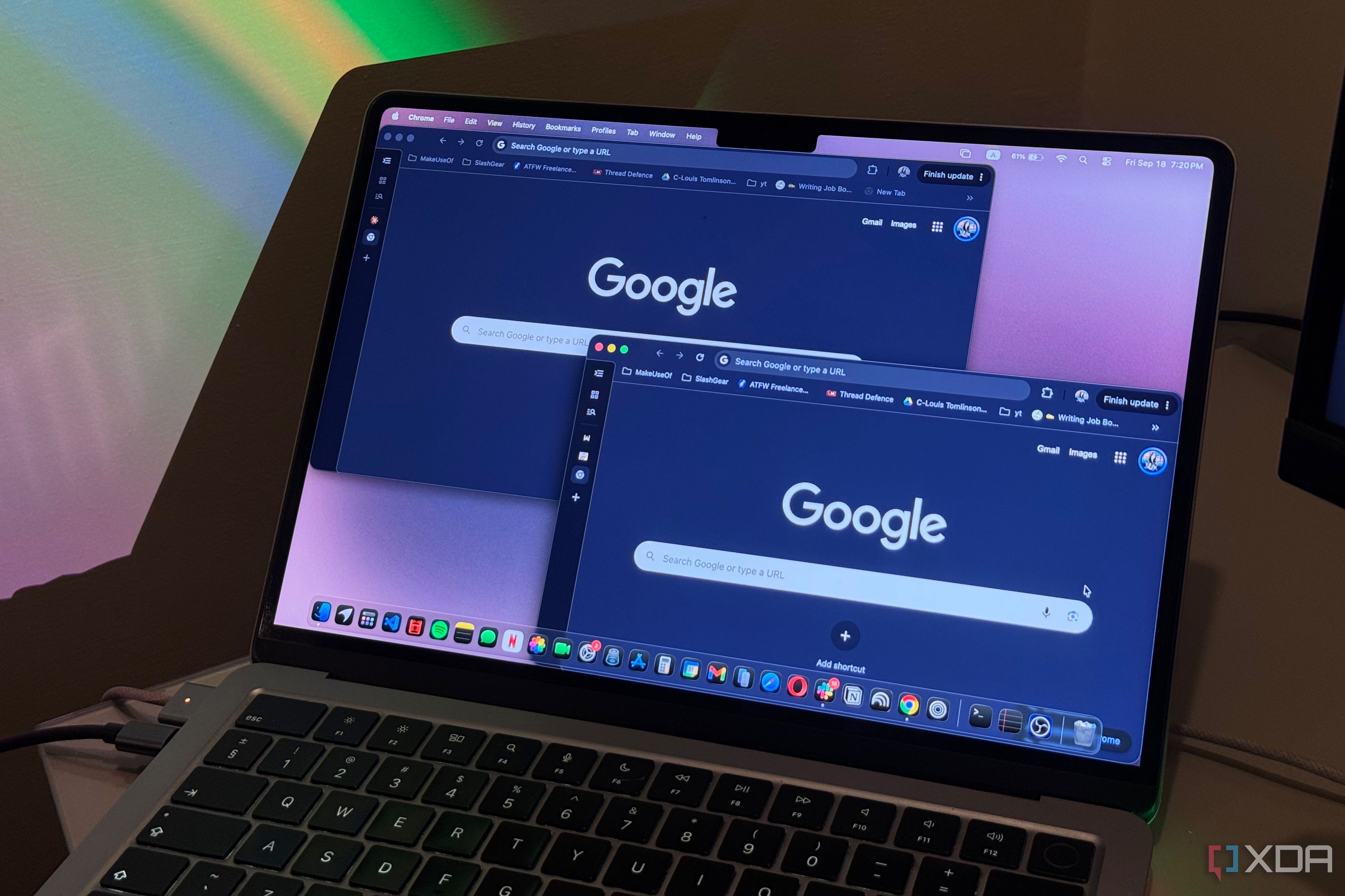 multiple windows of chrome displayed on macbook with blue light in the background