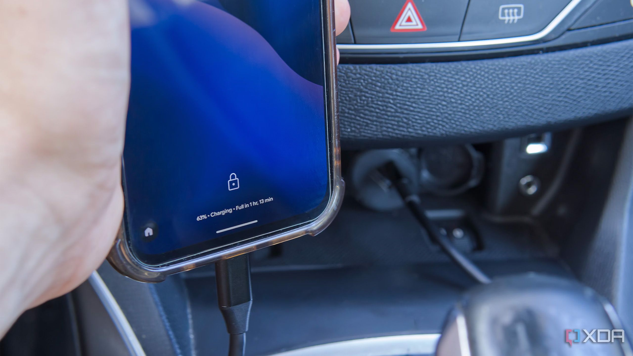 Close-up of a phone connected to a car charger via USB-C