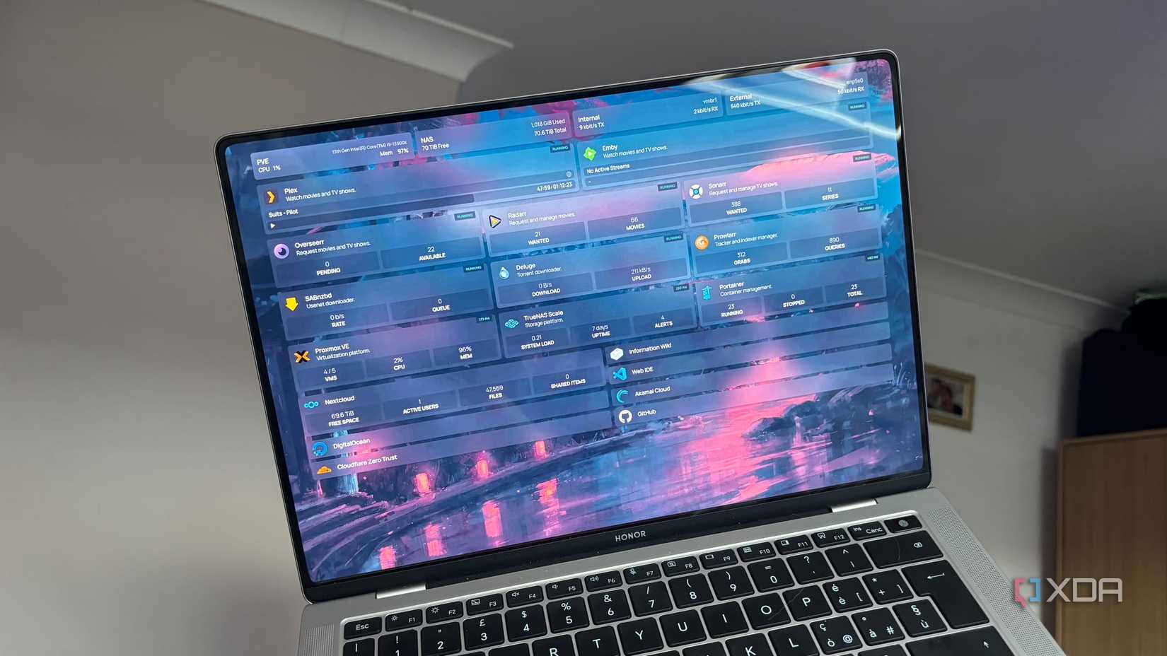 Homepage docker page on laptop being held up