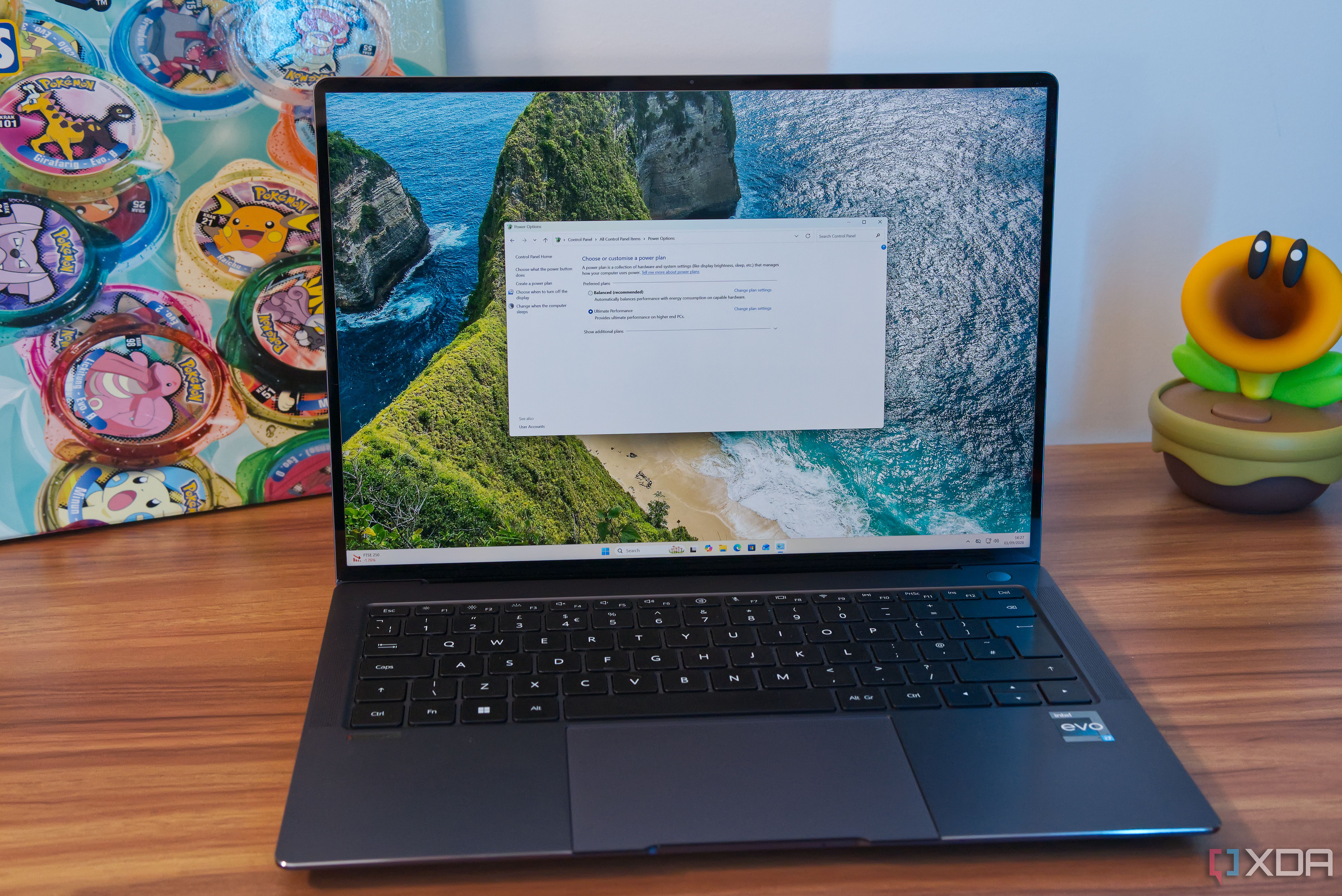 A laptop showing Control Panel with power plans, including the Ultimate Performance plan, which is currently selected