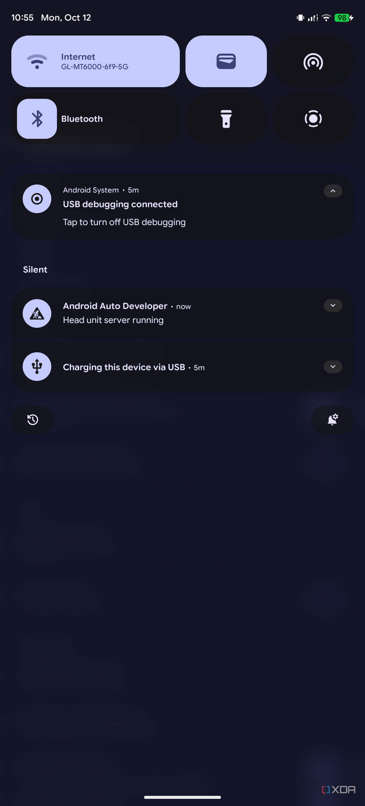 Screenshot of an Android notification dropdown showing that USB debugging is enabled and the Android Auto head unit server is running