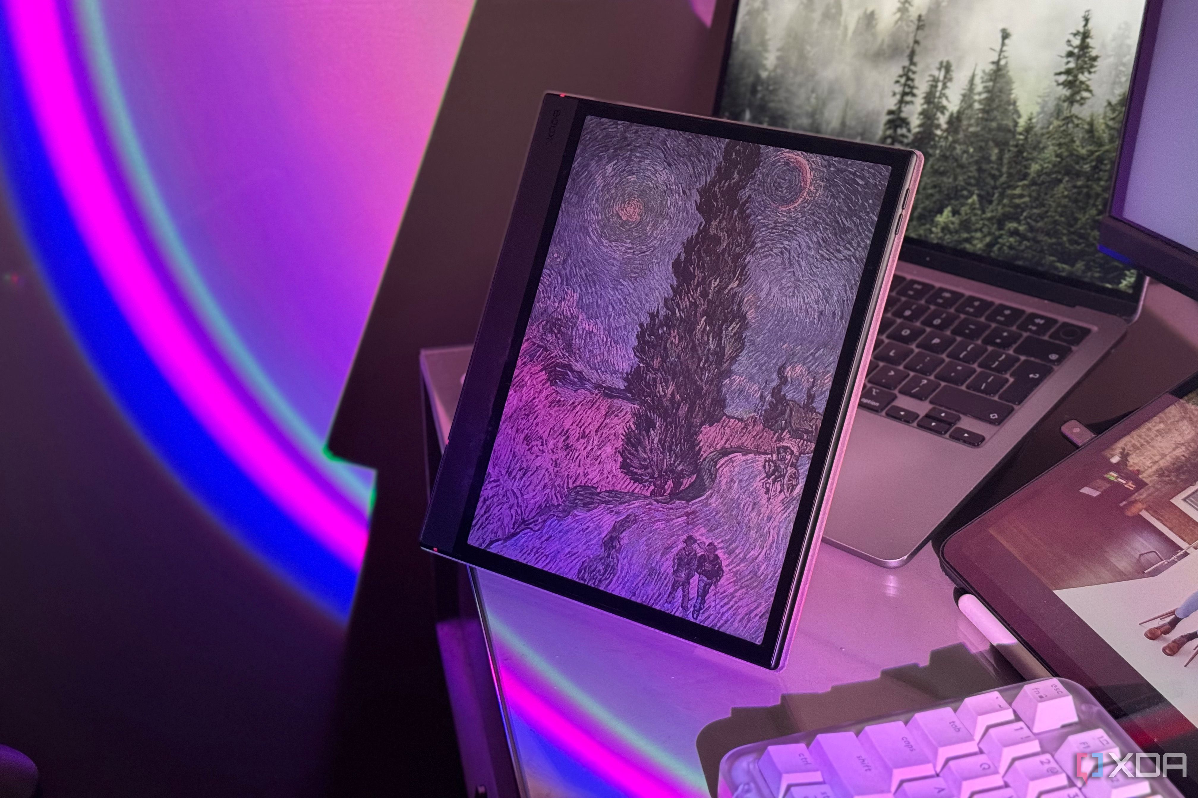 Boox tablet showing a Van Gogh painting in color, lit by a pink and blue light arc