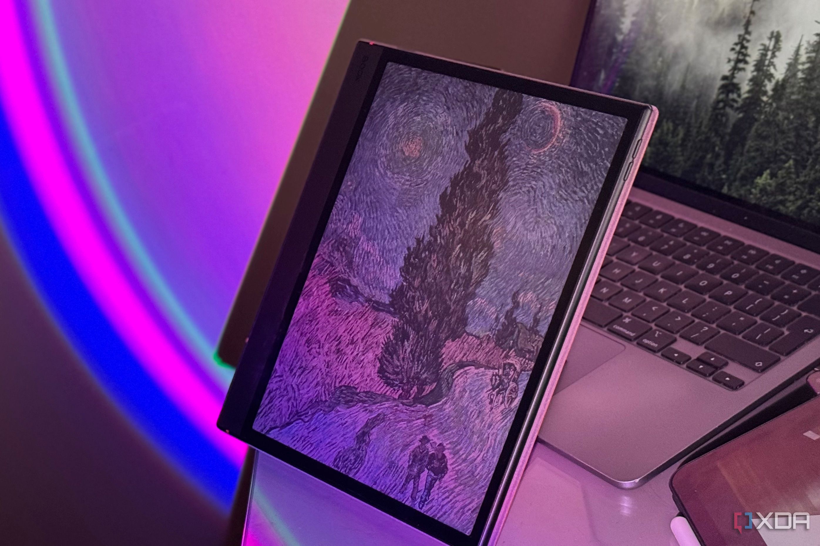 Close-up of a Boox tablet's color E Ink screen showing Van Gogh's swirling night sky