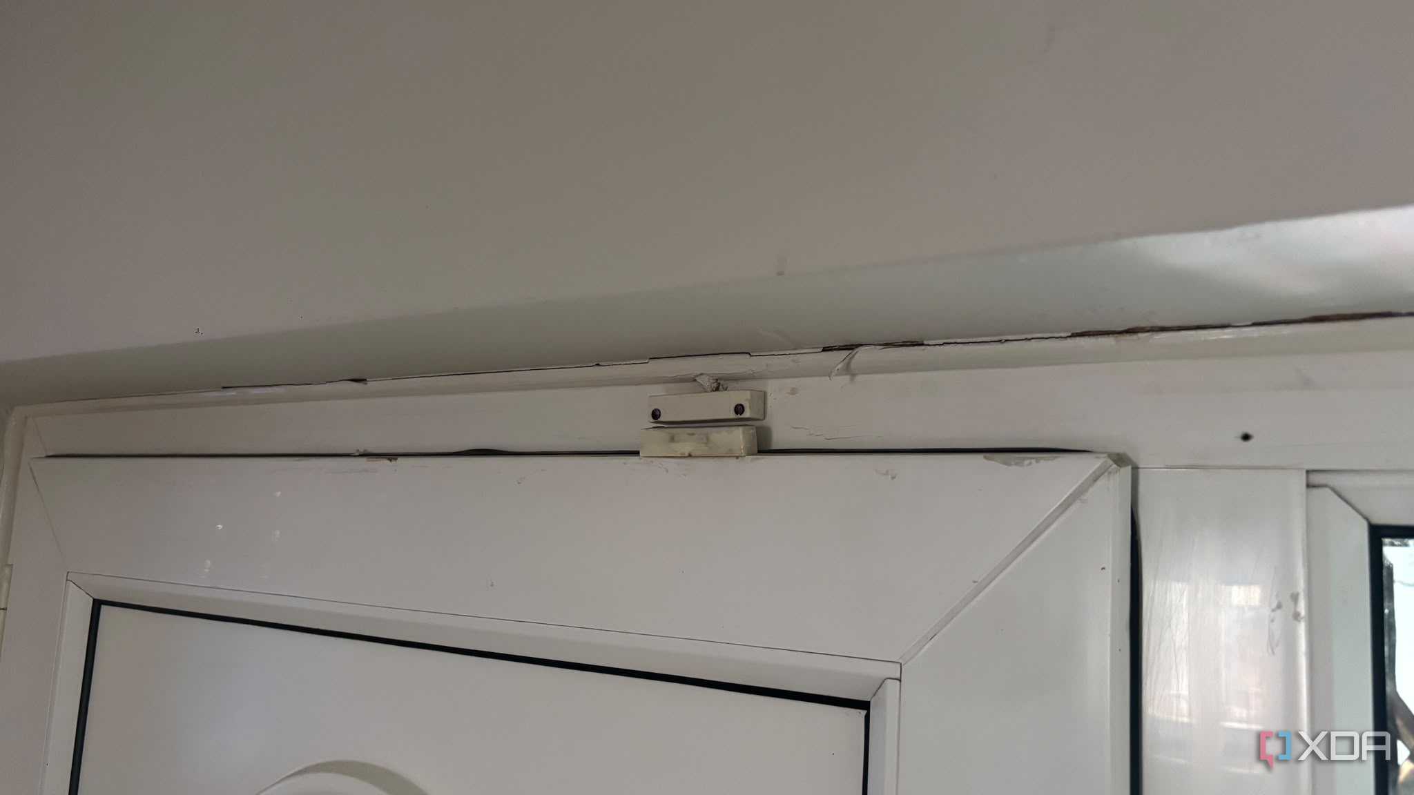 contact sensor on top of white door
