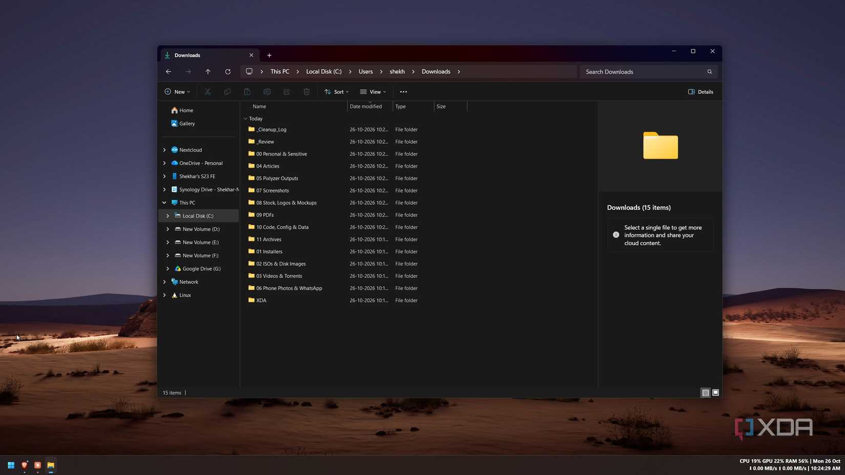 Windows File Explorer showing the Downloads folder with 15 category folders after the cleanup