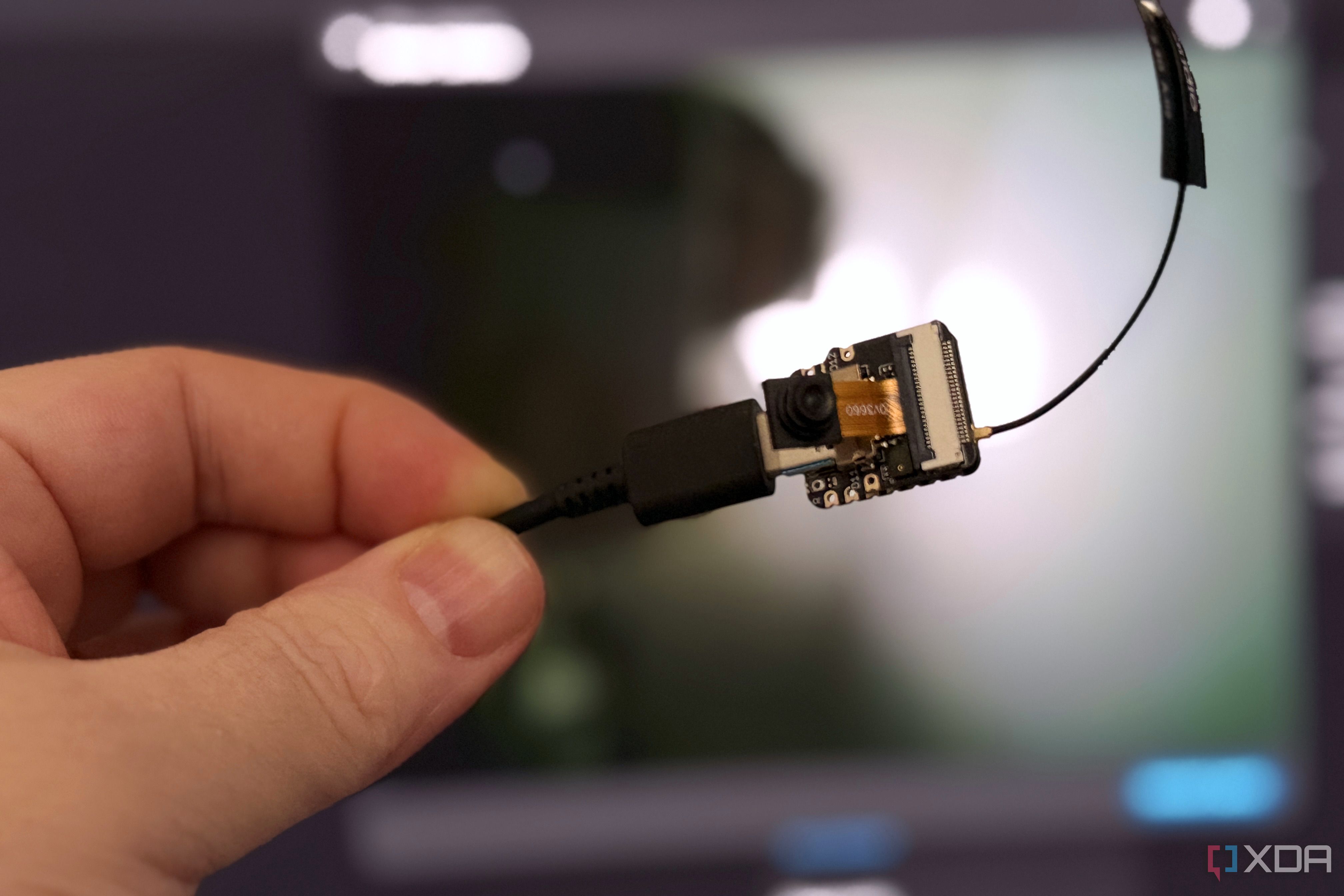 esp32-s3 held in front of home assistant video feed
