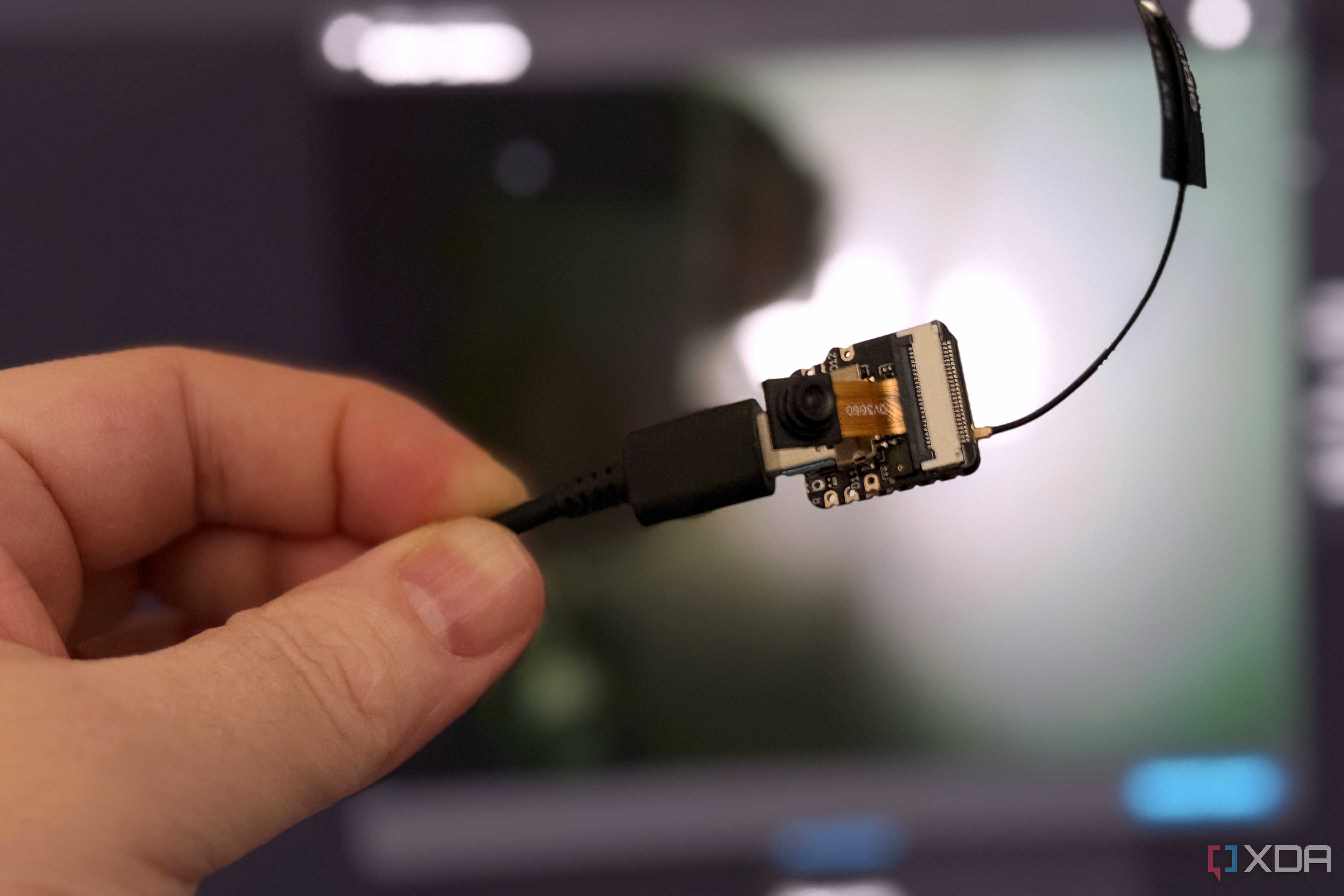 esp32-s3 held in front of home assistant video feed