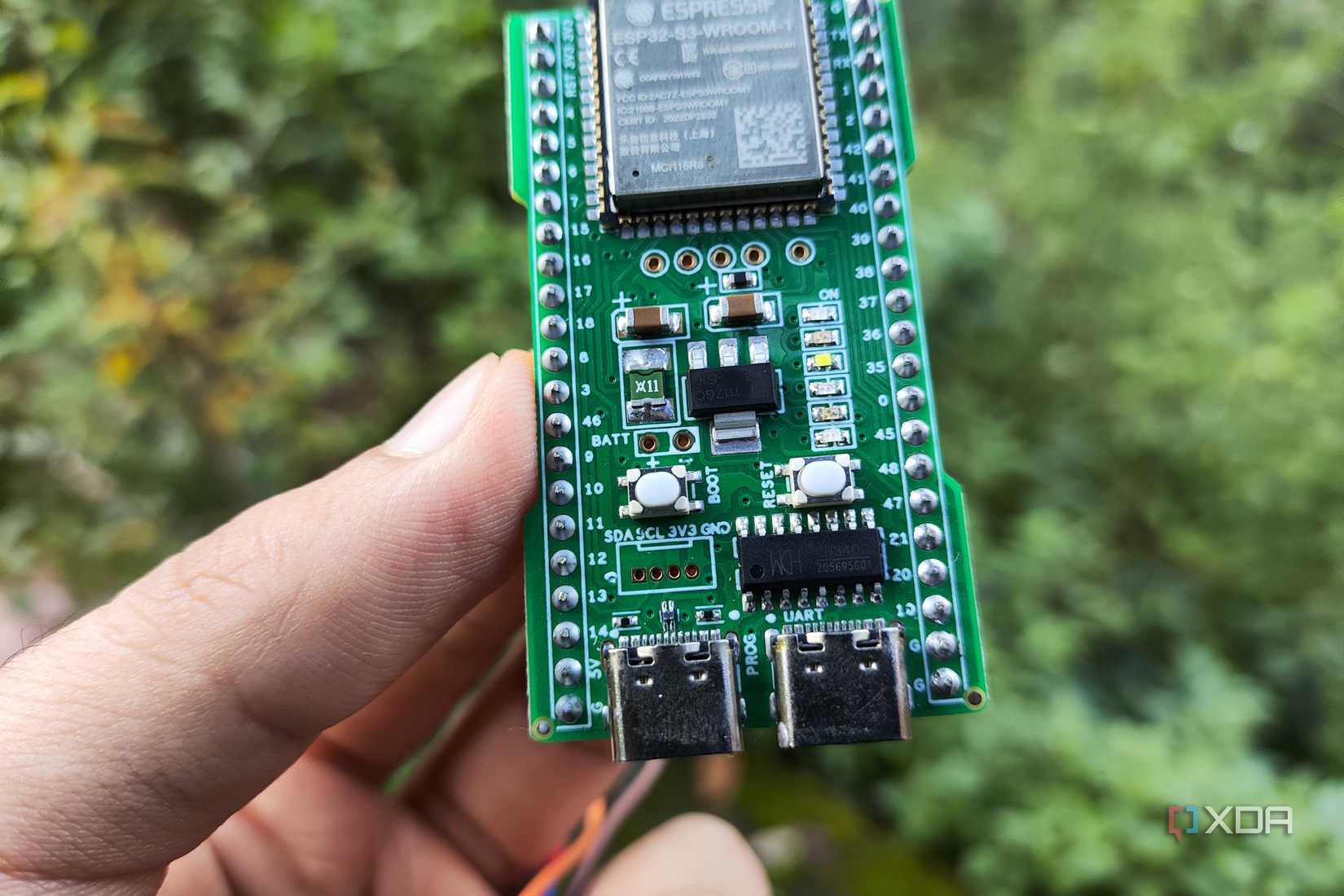 A person holding an ESP32-S3
