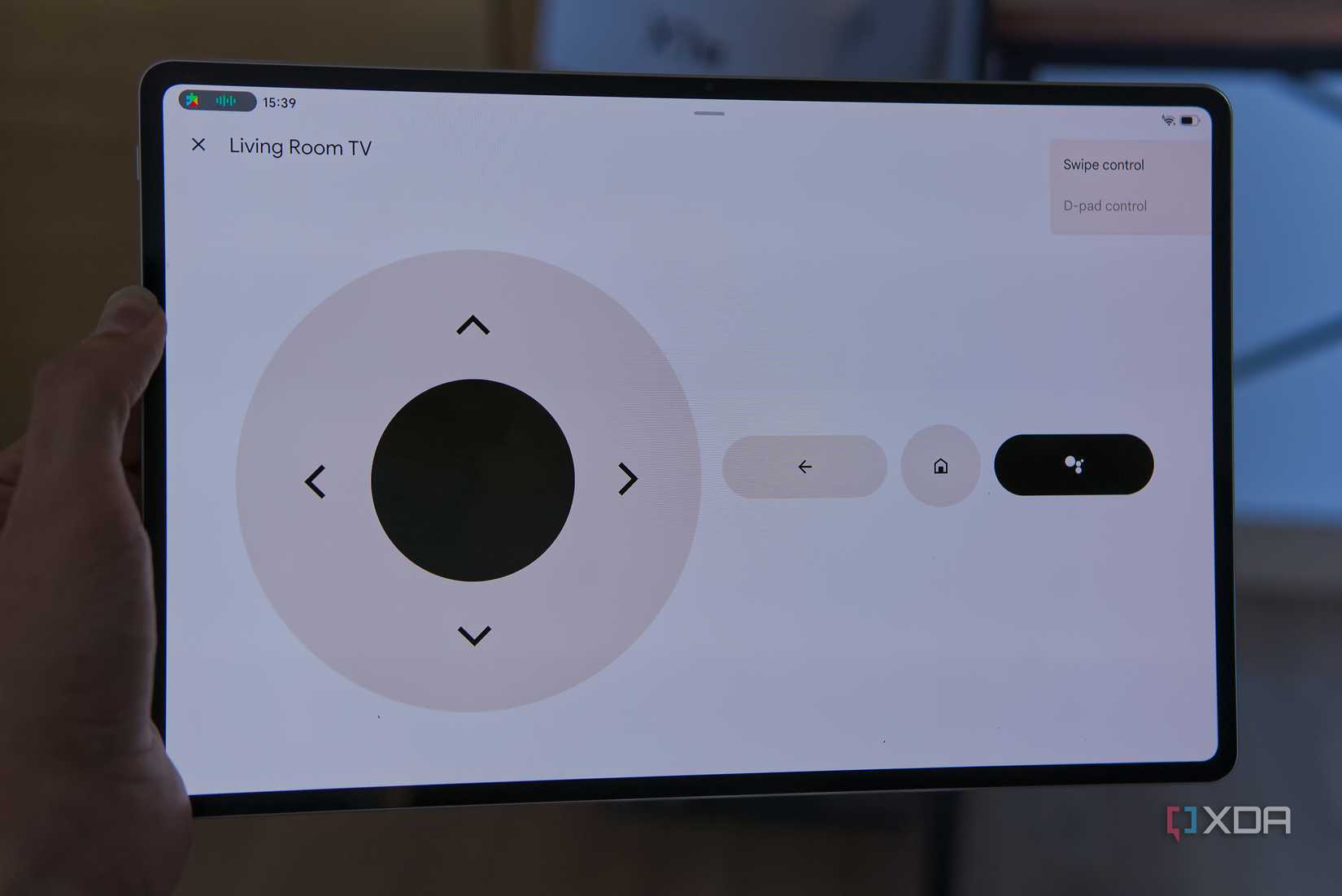 A tablet showing a remote control for an Android TV box