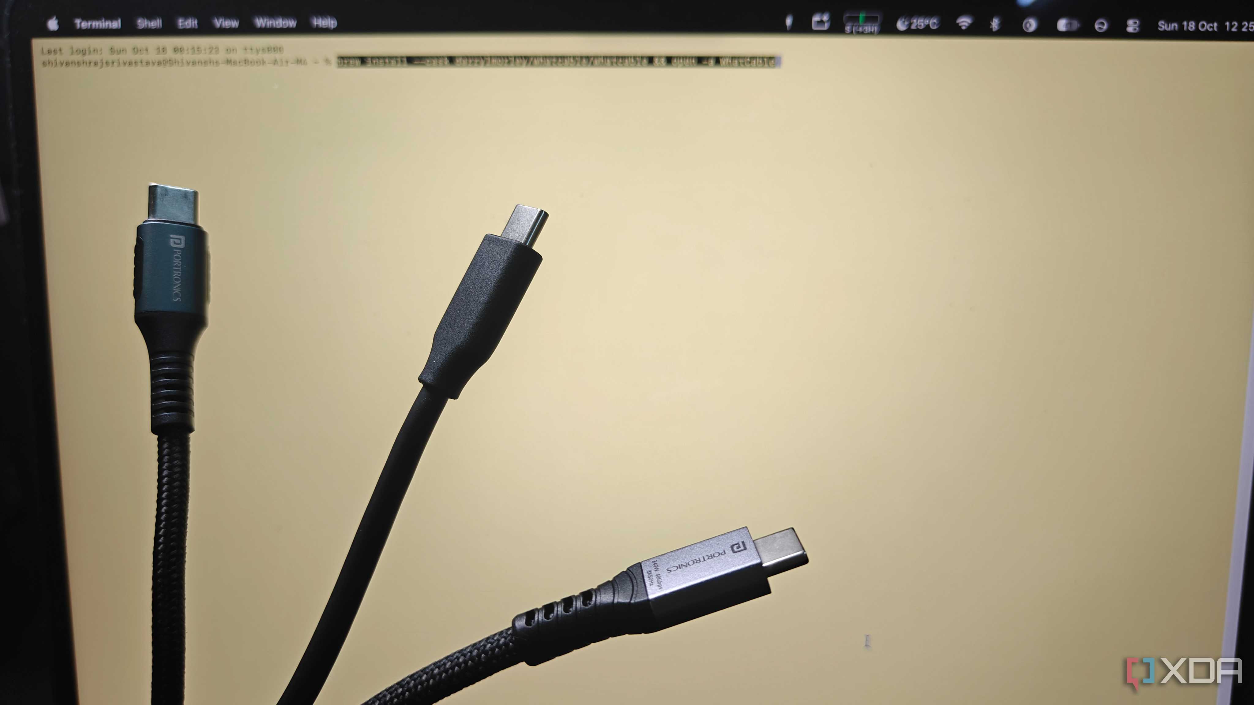 plugs of the konnect 240c, the samsung t7 shield cable and the flash c2 held up in front of a terminal window
